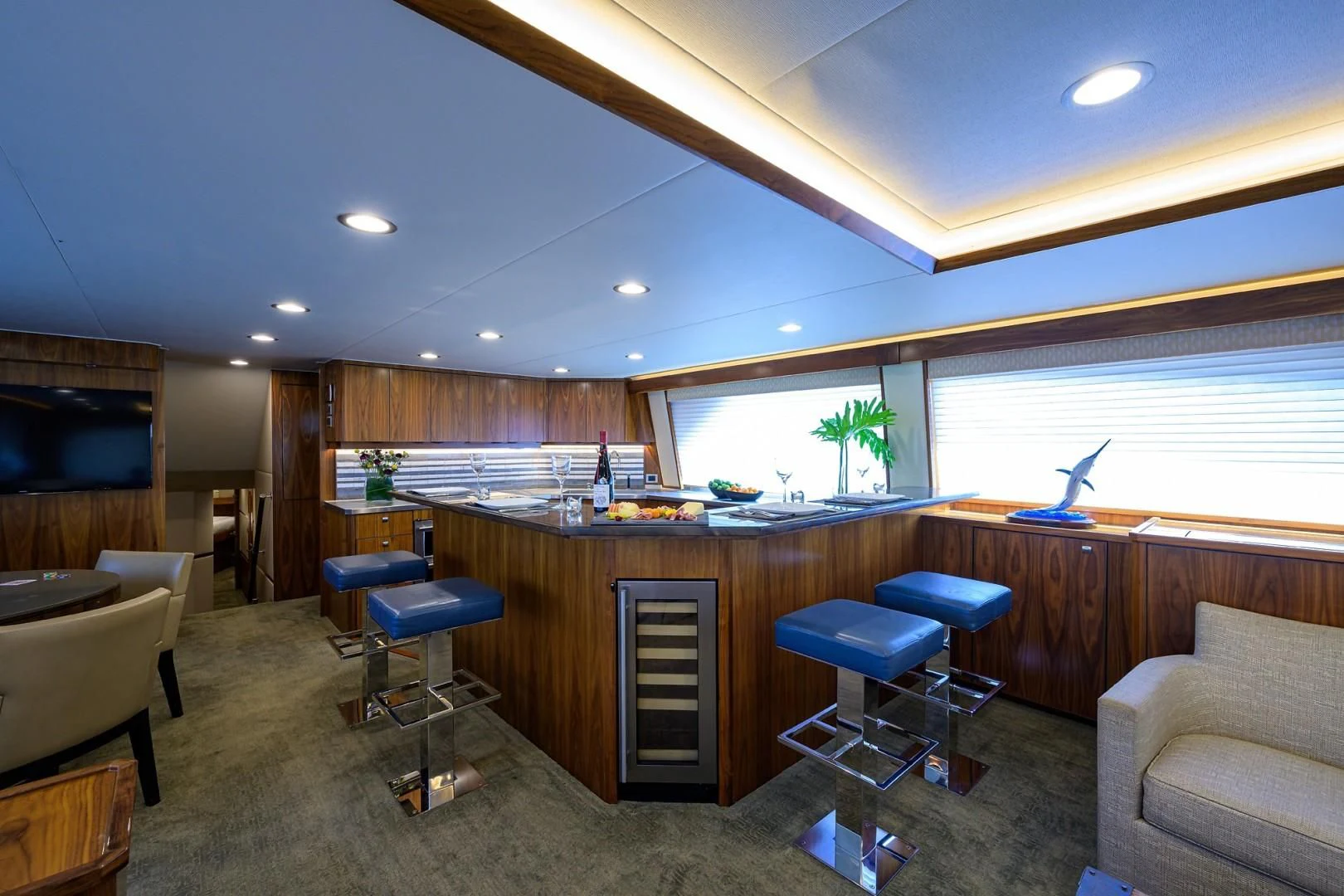 a room with a desk and chairs aboard SWEETUMS Yacht for Sale