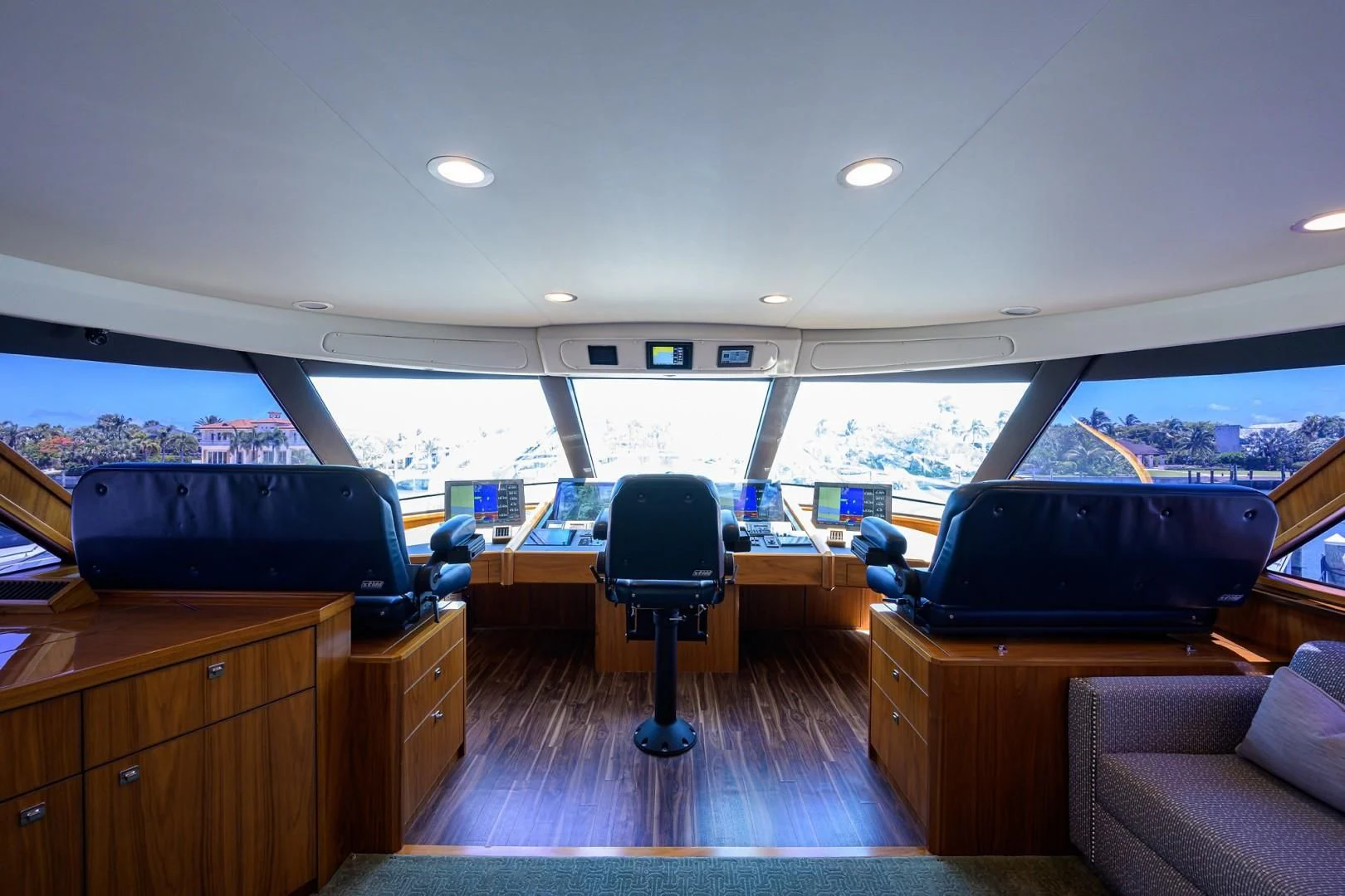 a room with a deck and a view of the water aboard SWEETUMS Yacht for Sale