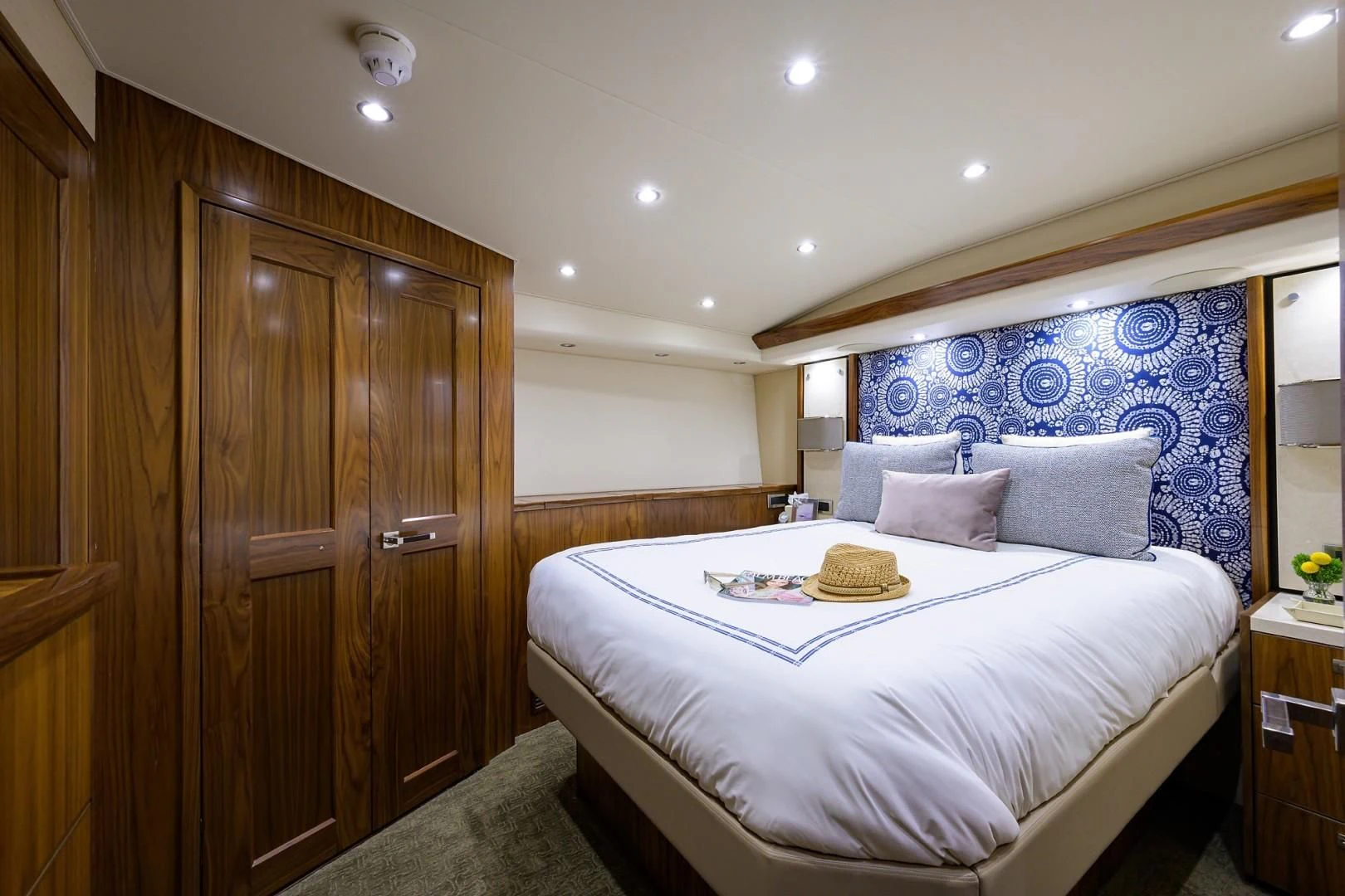 a bedroom with a bed and a closet aboard SWEETUMS Yacht for Sale