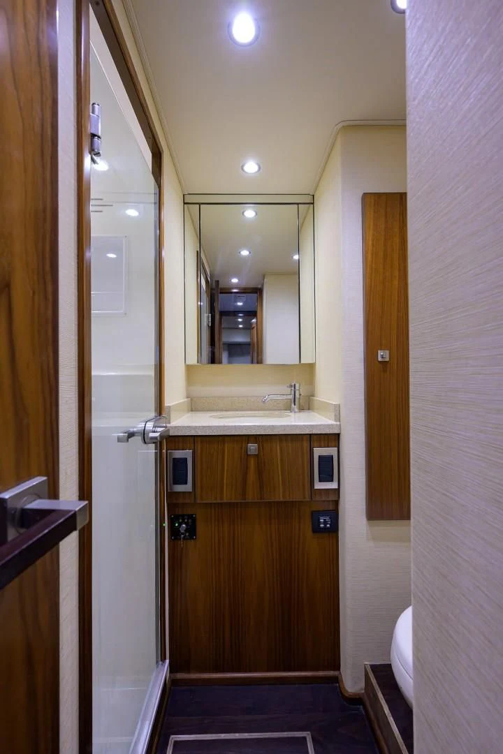 a bathroom with a sink and a mirror aboard SWEETUMS Yacht for Sale