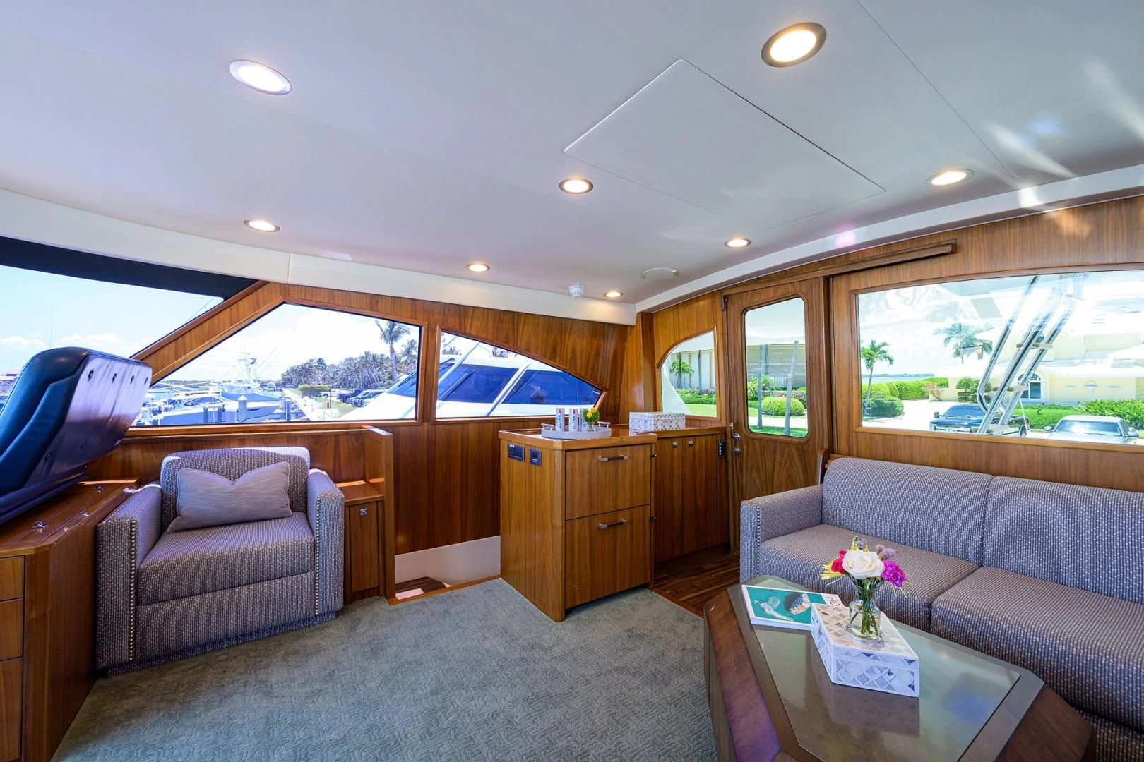 a living room with a large window aboard SWEETUMS Yacht for Sale