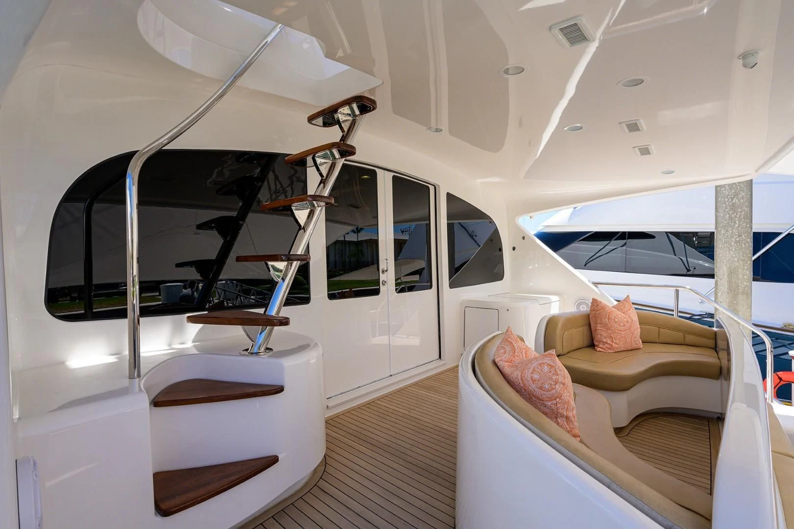 a modern looking room with a glass ceiling and a staircase aboard SWEETUMS Yacht for Sale