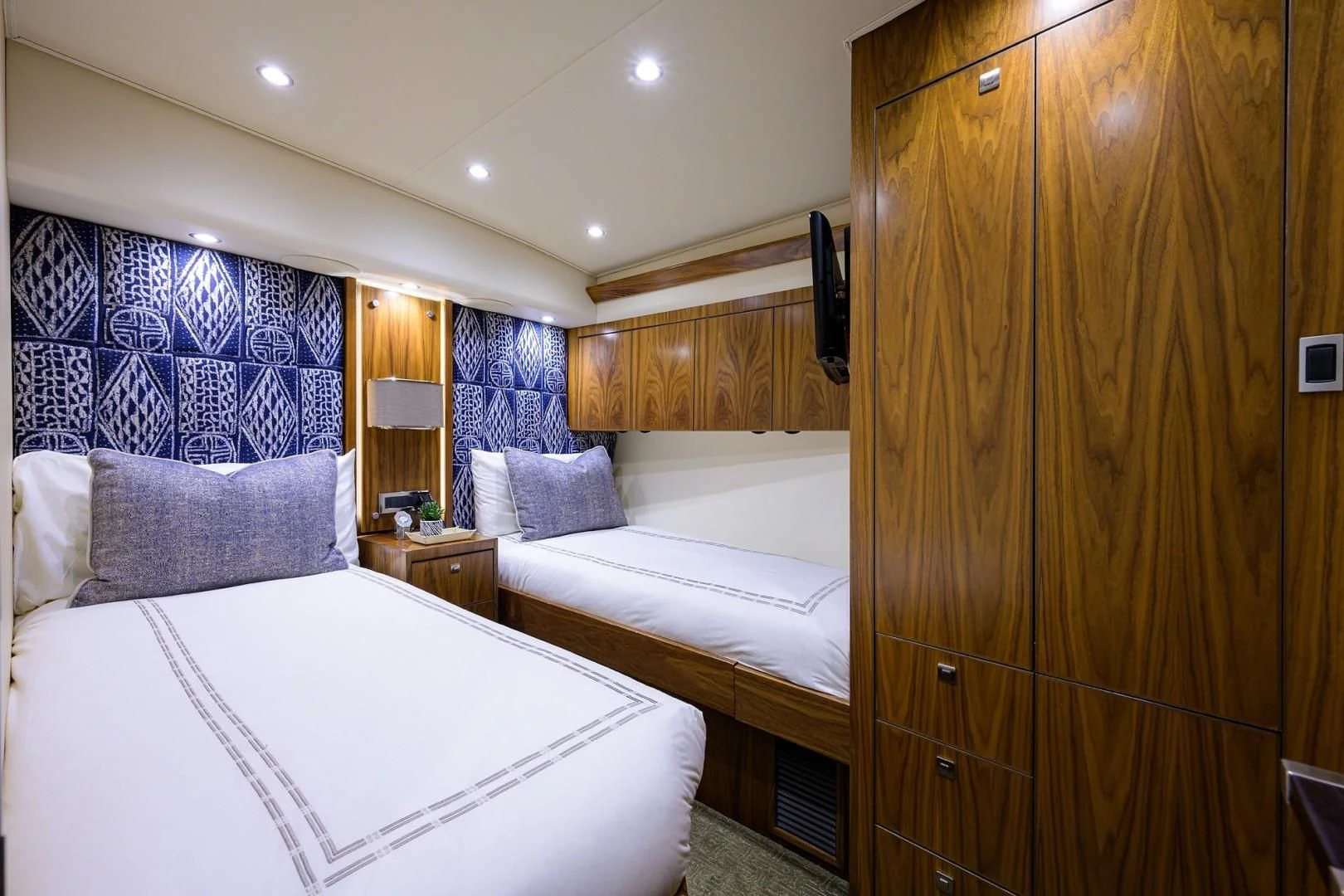 a room with a bed and a closet aboard SWEETUMS Yacht for Sale