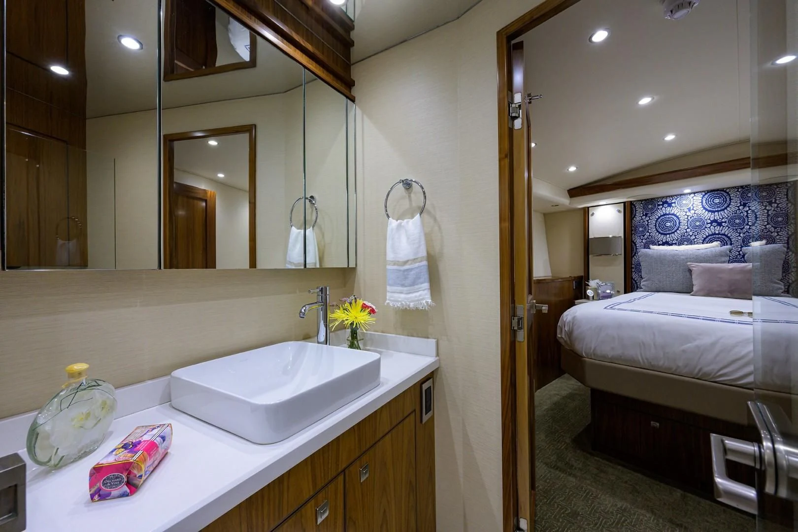 a bathroom with a sink and a mirror aboard SWEETUMS Yacht for Sale