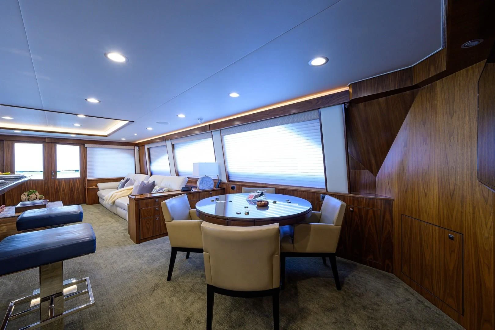 a room with a table and chairs aboard SWEETUMS Yacht for Sale