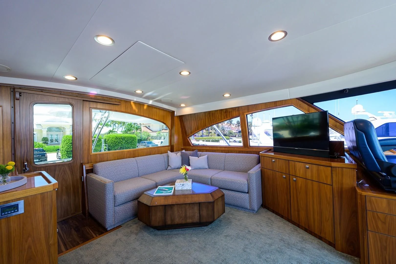 a living room with a couch and a tv aboard SWEETUMS Yacht for Sale