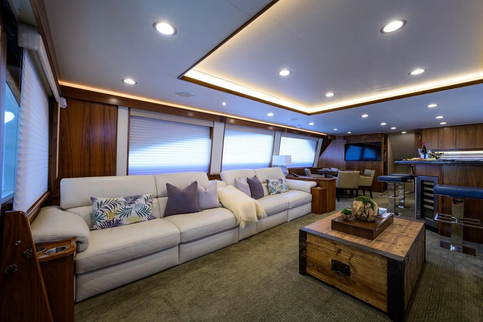 a living room with a couch and a table aboard SWEETUMS Yacht for Sale