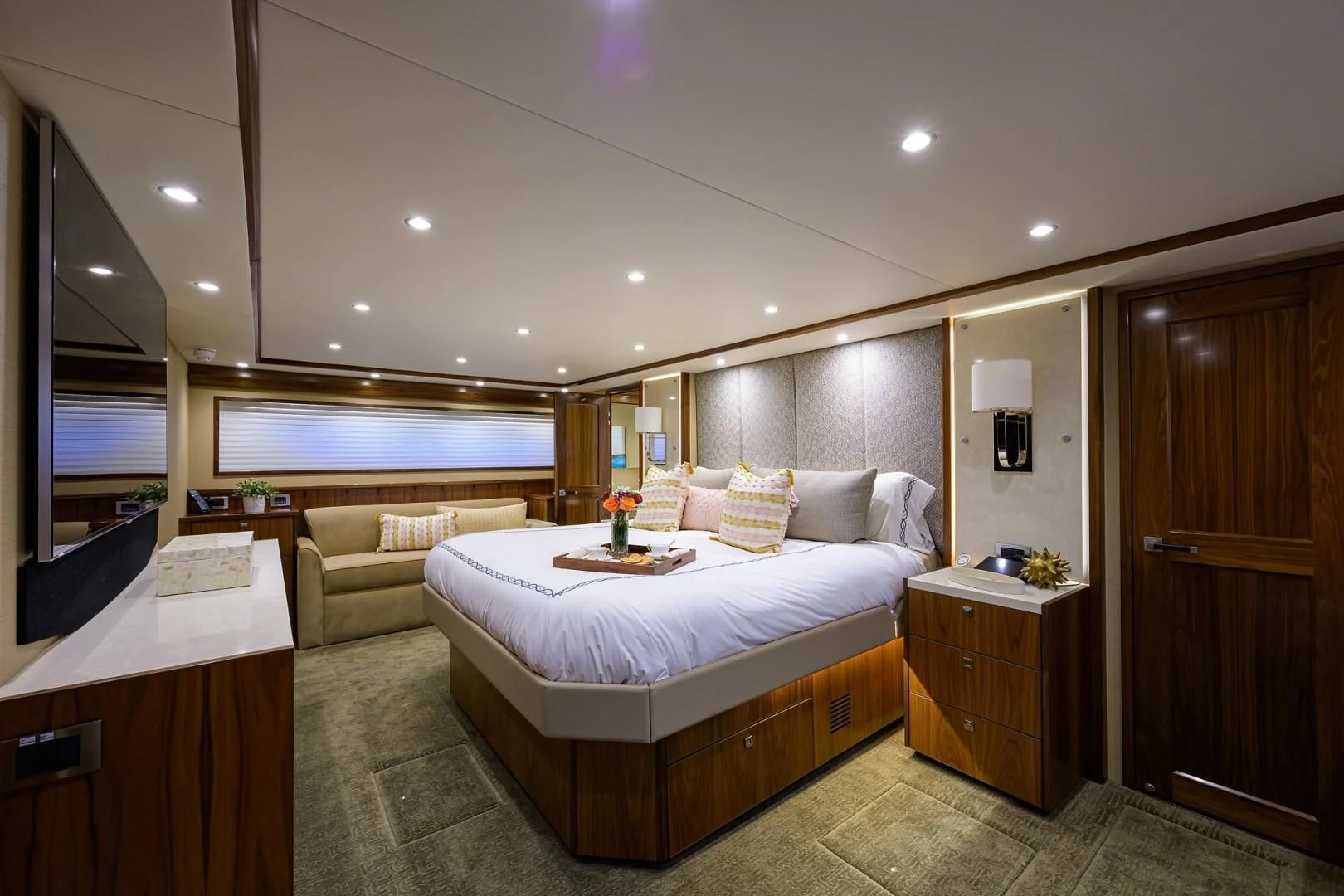 a bedroom with a bed and a desk aboard SWEETUMS Yacht for Sale
