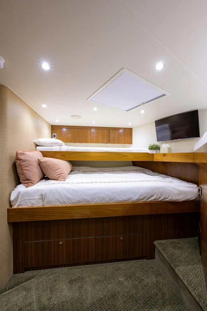 a bed with a white bed and a white ceiling aboard SWEETUMS Yacht for Sale