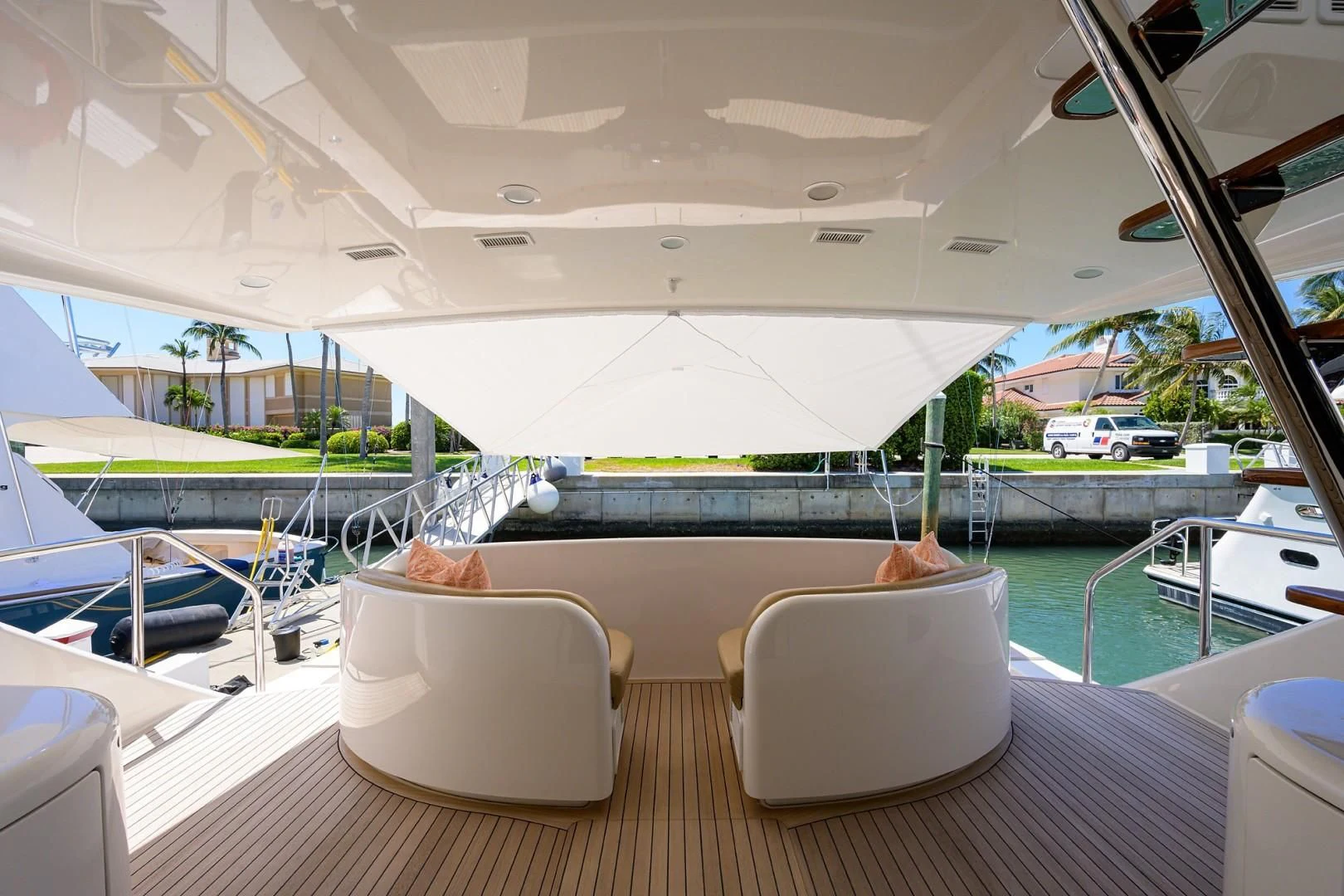 a boat with a chair and a table on it aboard SWEETUMS Yacht for Sale