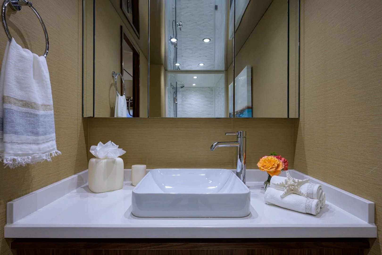 a bathroom with a sink and towels aboard SWEETUMS Yacht for Sale