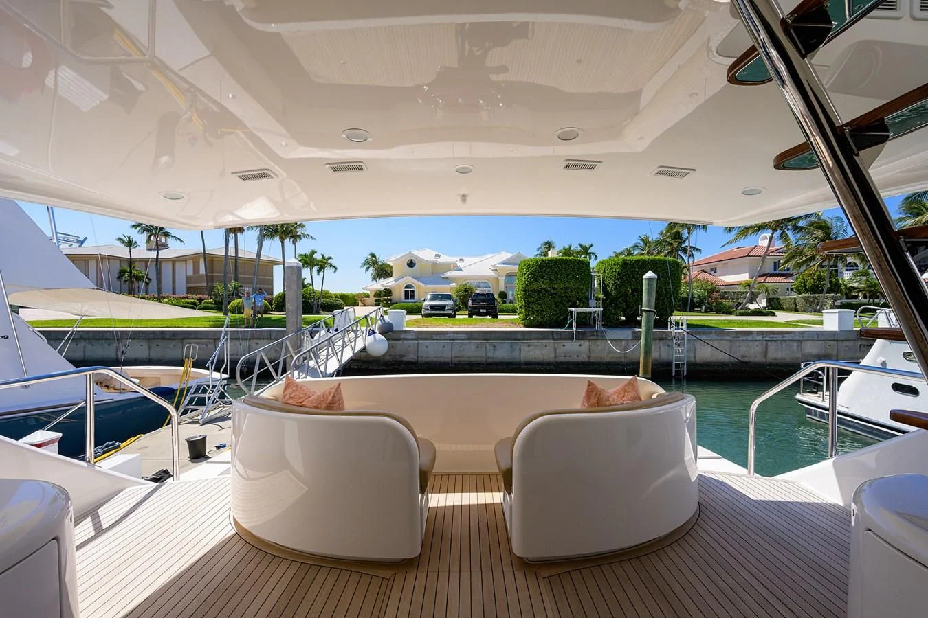 a room with a view of a city and a pool aboard SWEETUMS Yacht for Sale