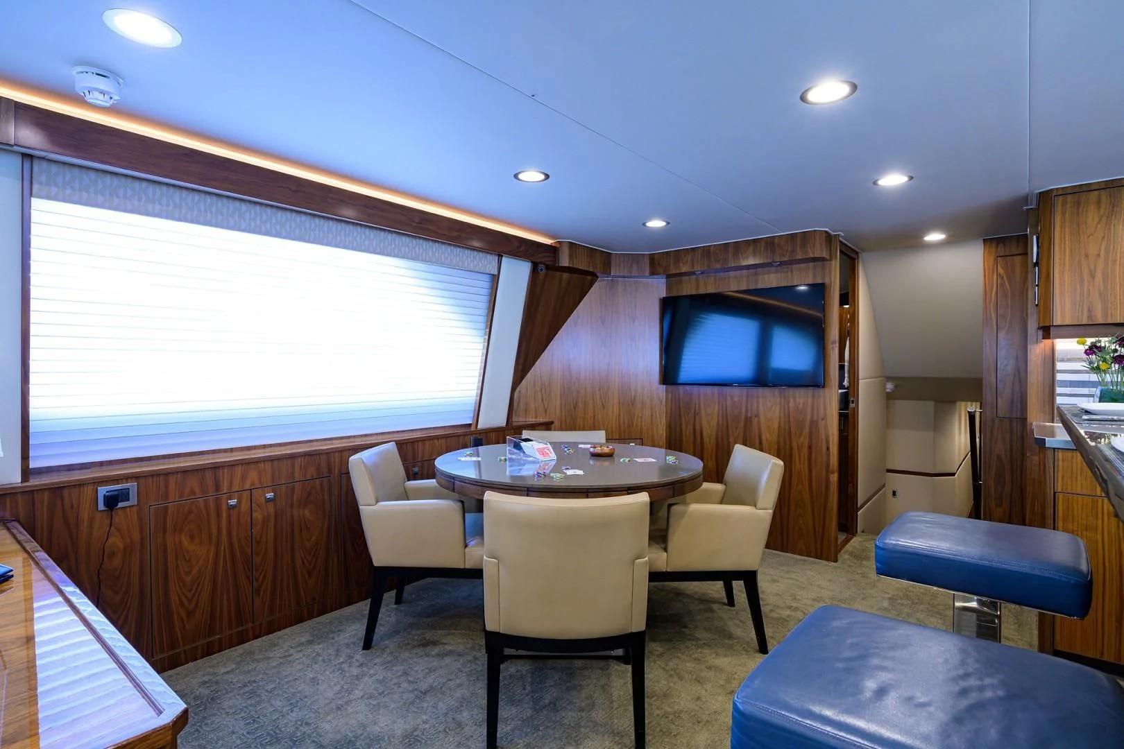 a room with a table and chairs aboard SWEETUMS Yacht for Sale