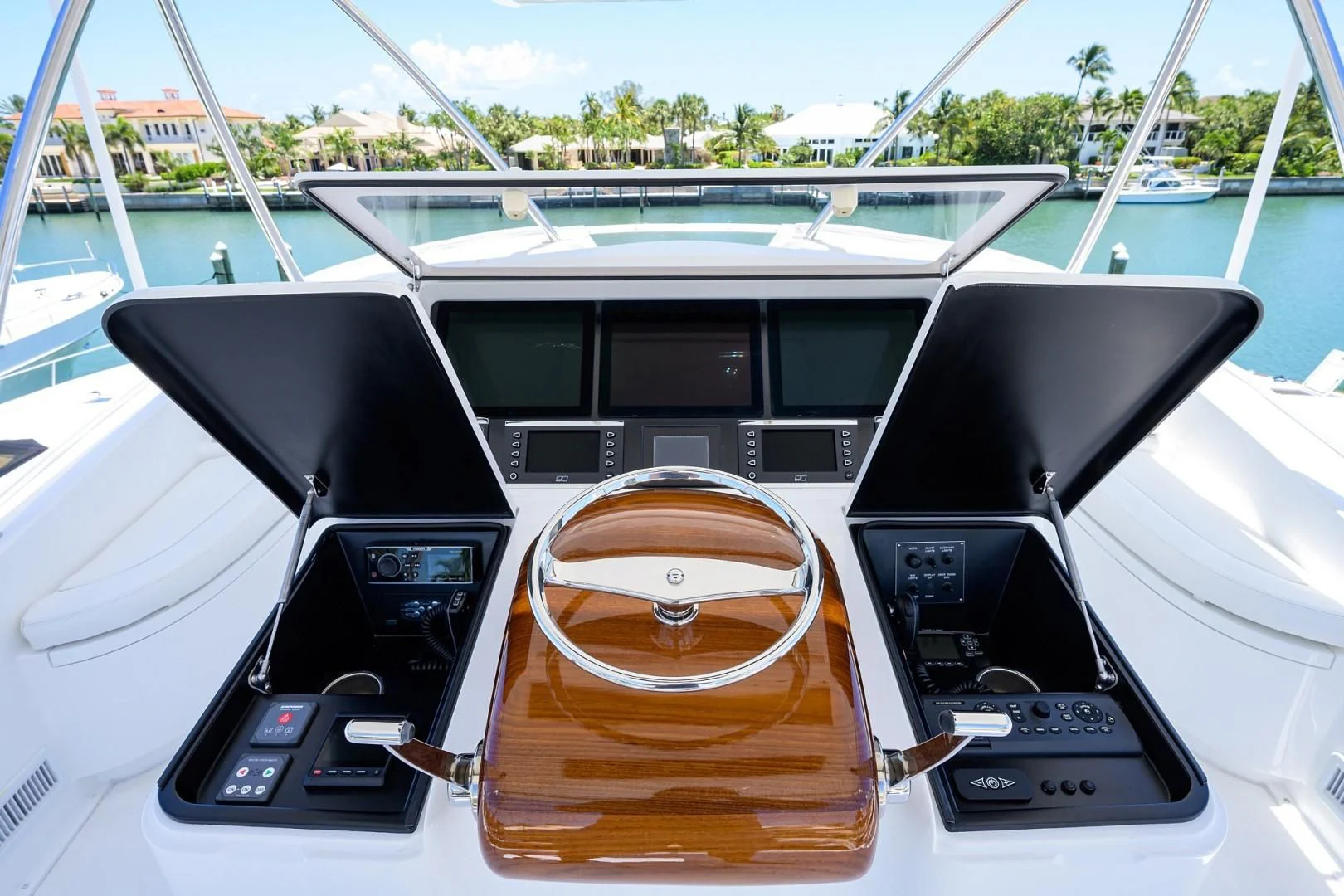 a boat with a steering wheel aboard SWEETUMS Yacht for Sale
