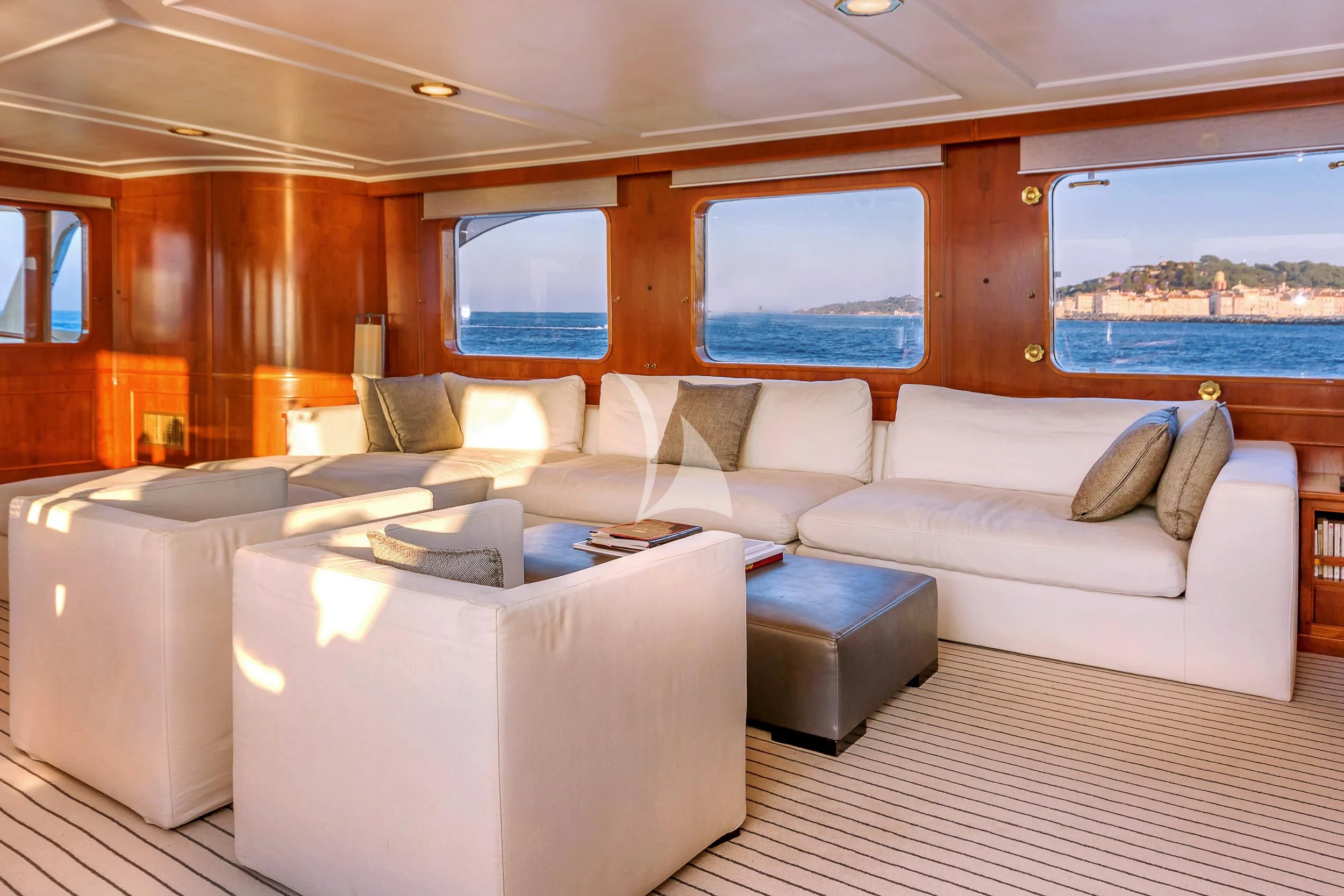 a living room with a couch and a window aboard SECRET LIFE Yacht for Sale