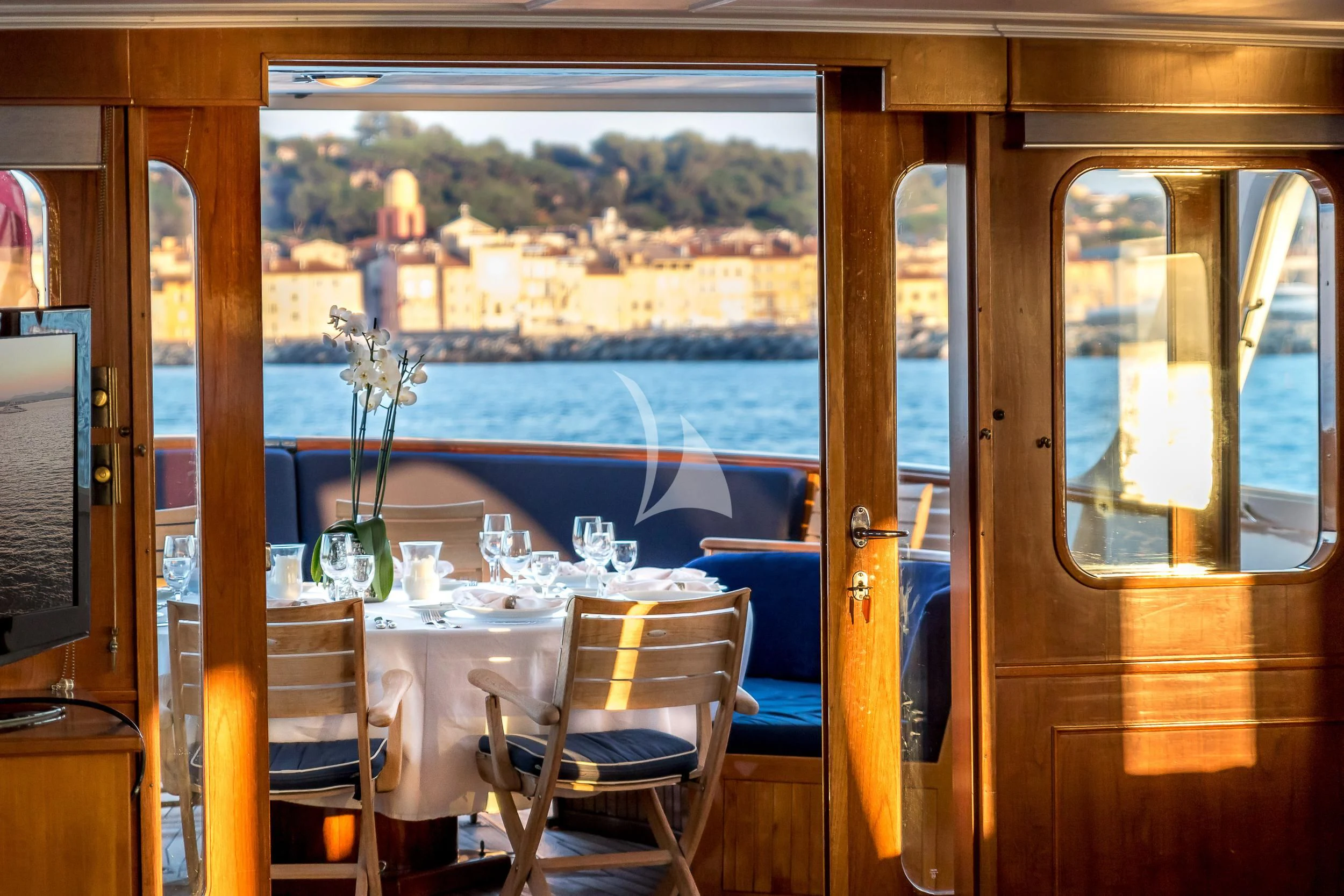 a table and chairs in a restaurant aboard SECRET LIFE Yacht for Sale
