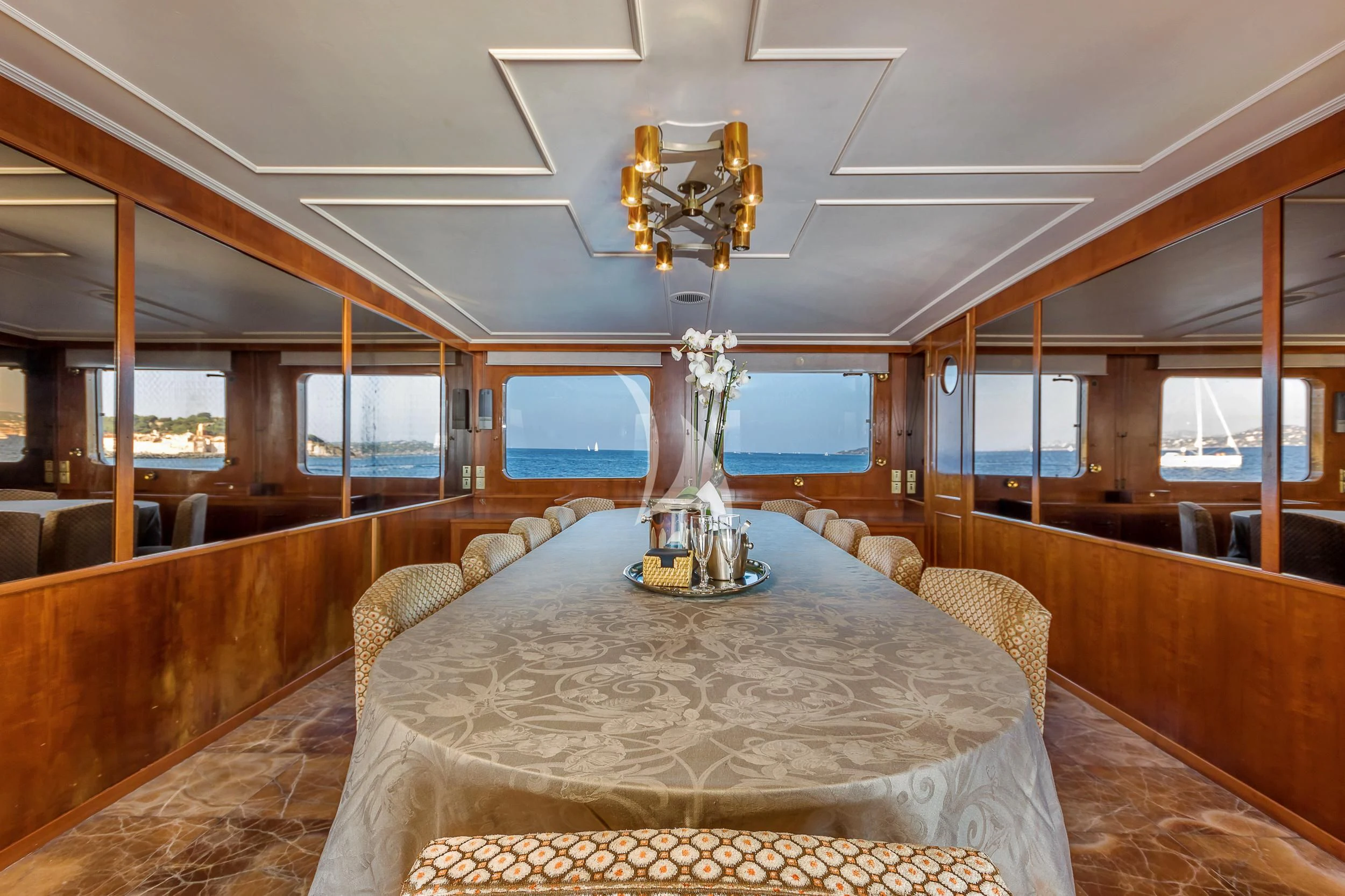 a large room with a chandelier and a chandelier aboard SECRET LIFE Yacht for Sale