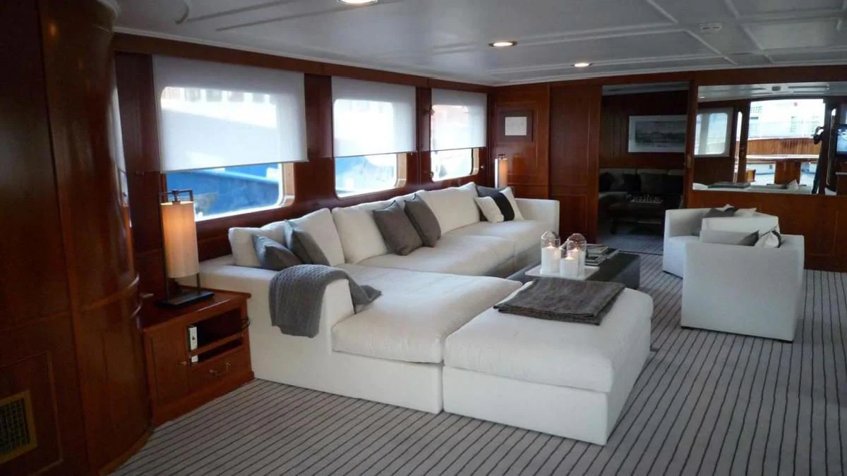 a large room with a bed and a piano aboard SECRET LIFE Yacht for Sale