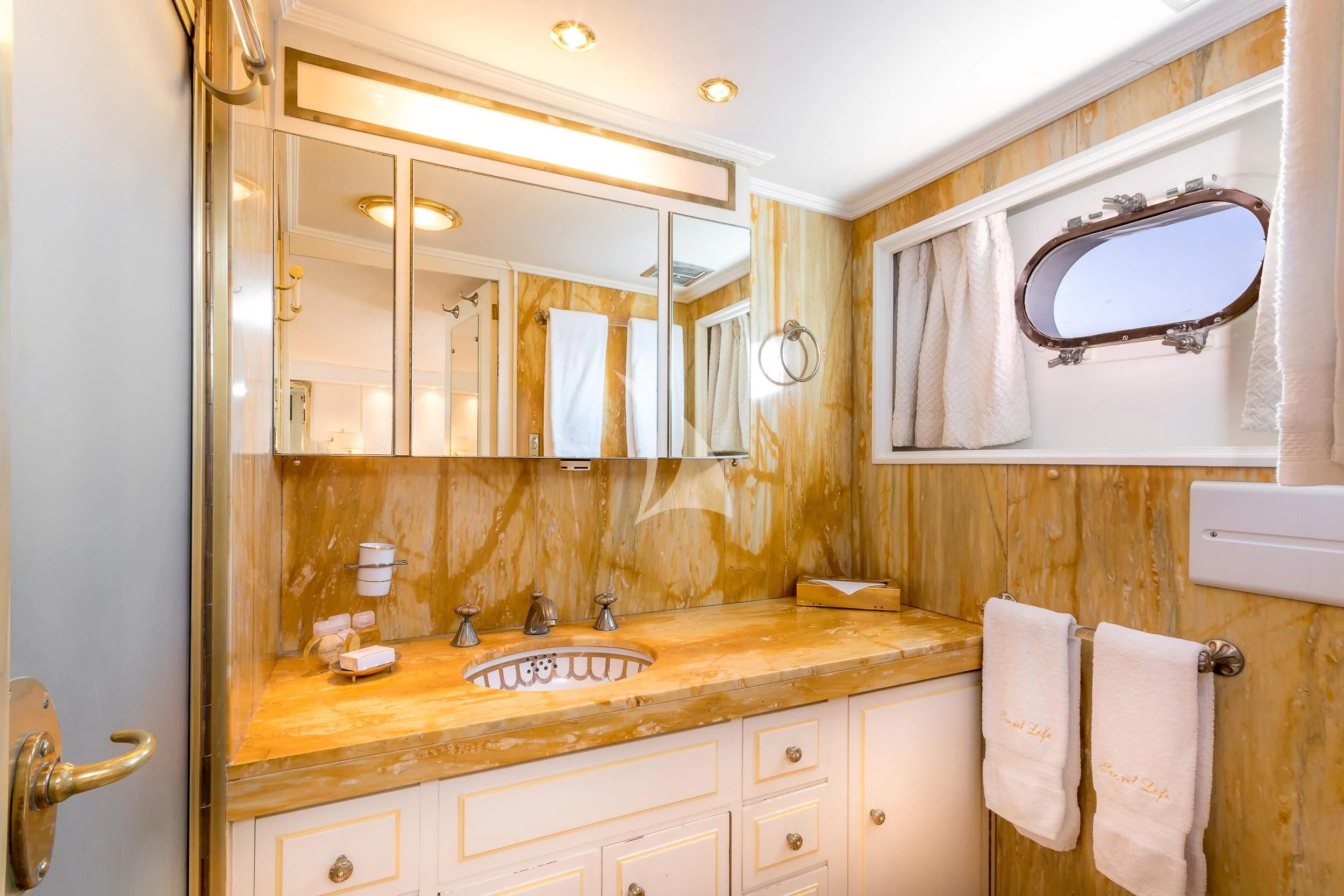 a bathroom with a sink and a mirror aboard SECRET LIFE Yacht for Sale