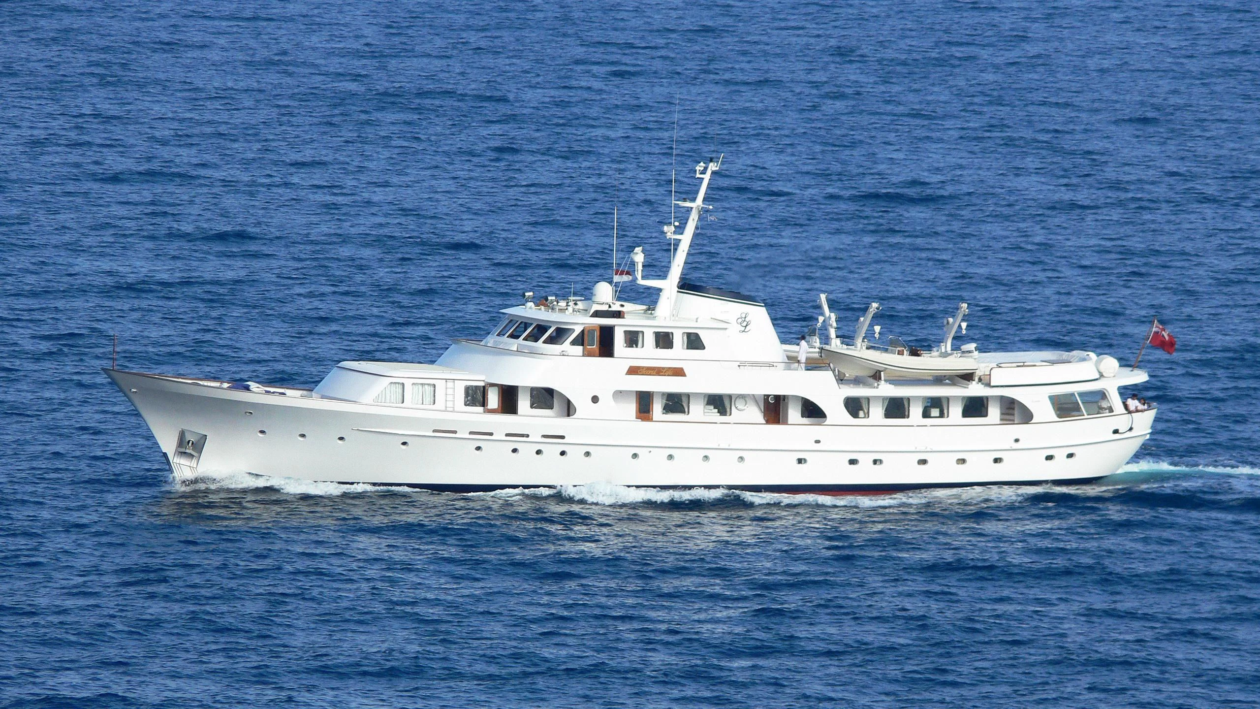 a white boat in the water aboard SECRET LIFE Yacht for Sale
