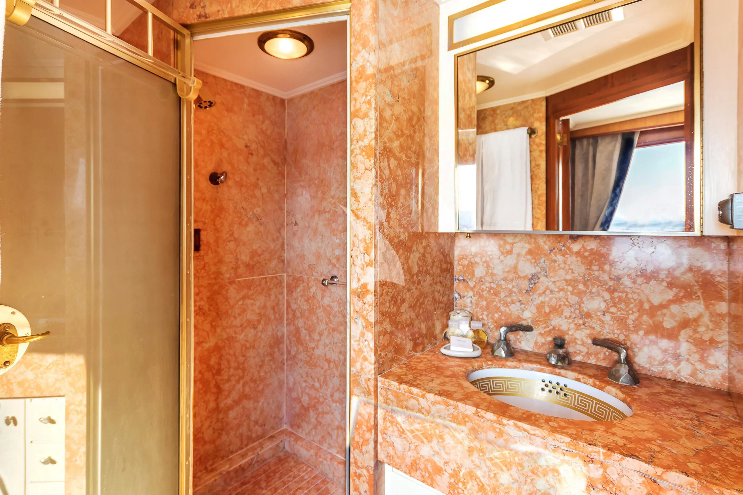 a bathroom with a sink and a mirror aboard SECRET LIFE Yacht for Sale
