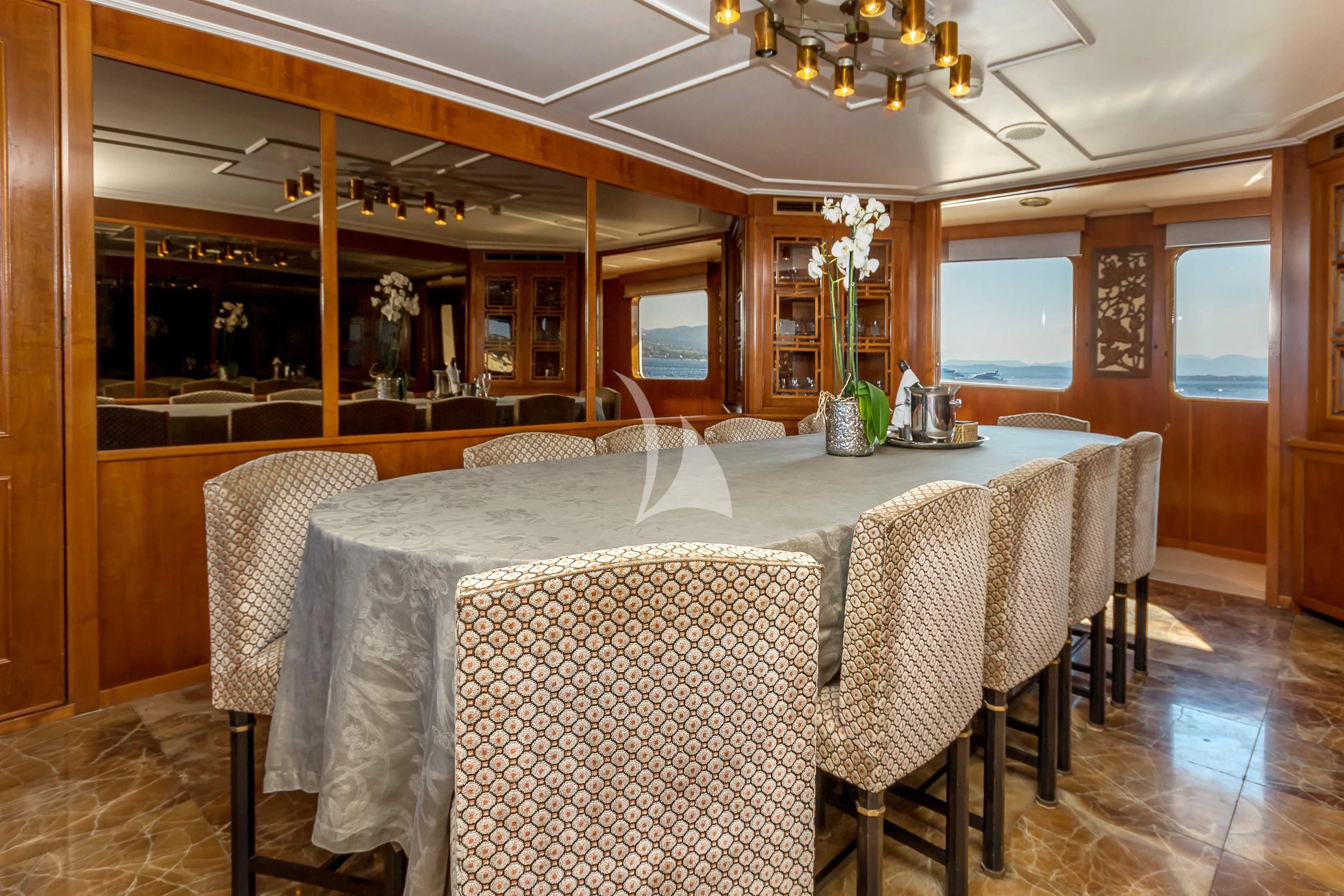 a dining table set for a dinner aboard SECRET LIFE Yacht for Sale