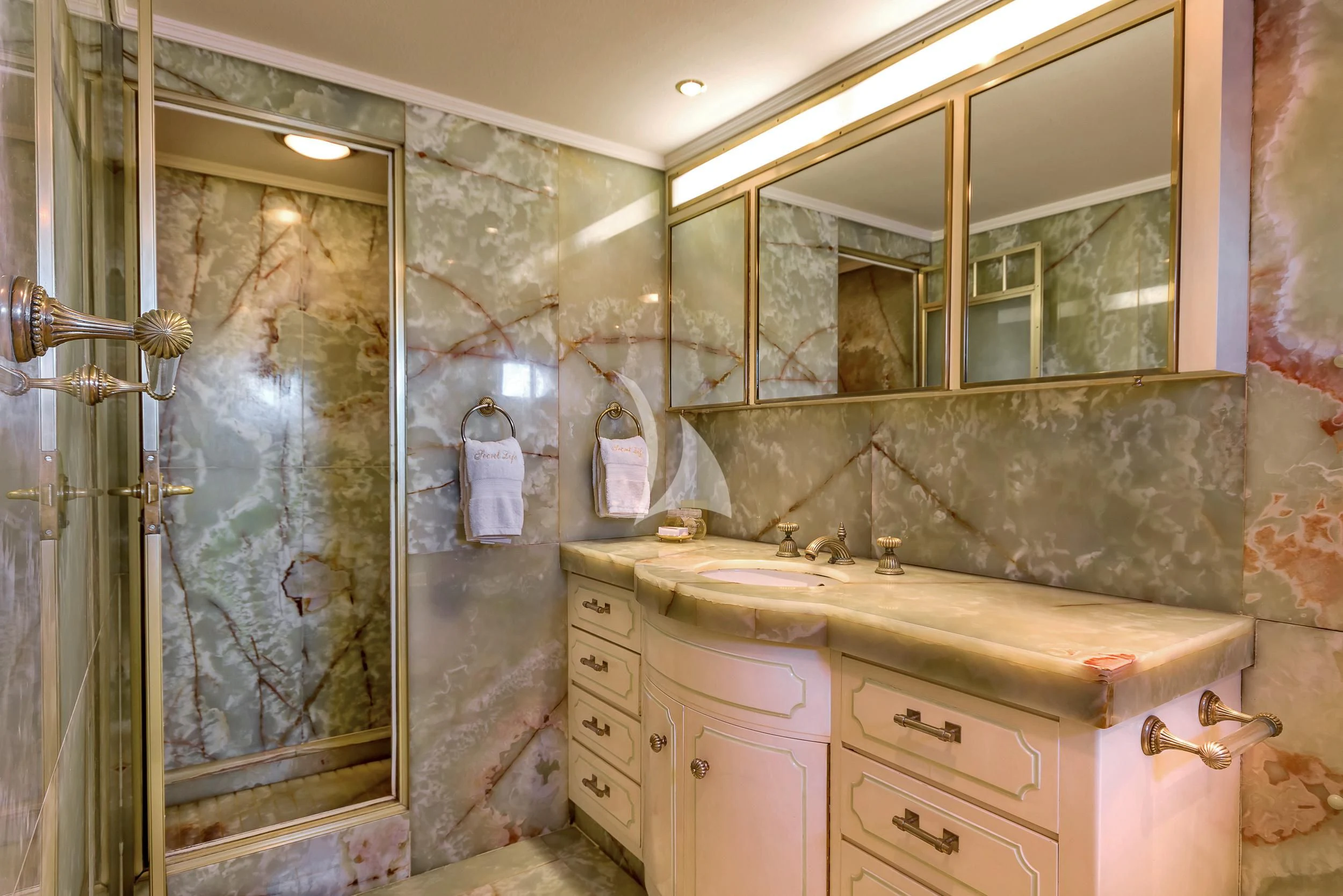 a bathroom with a glass shower aboard SECRET LIFE Yacht for Sale