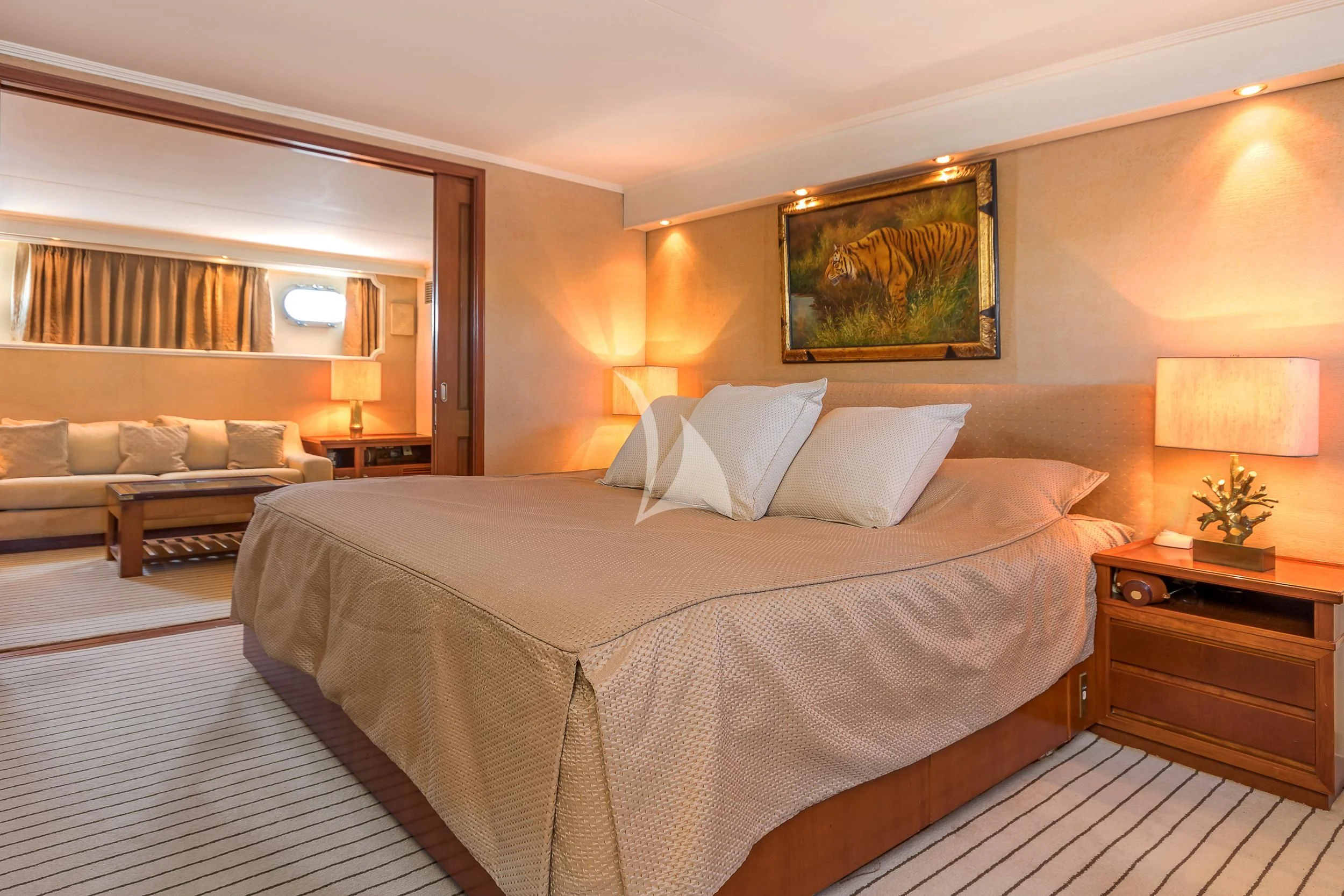a hotel room with a bed and a couch aboard SECRET LIFE Yacht for Sale