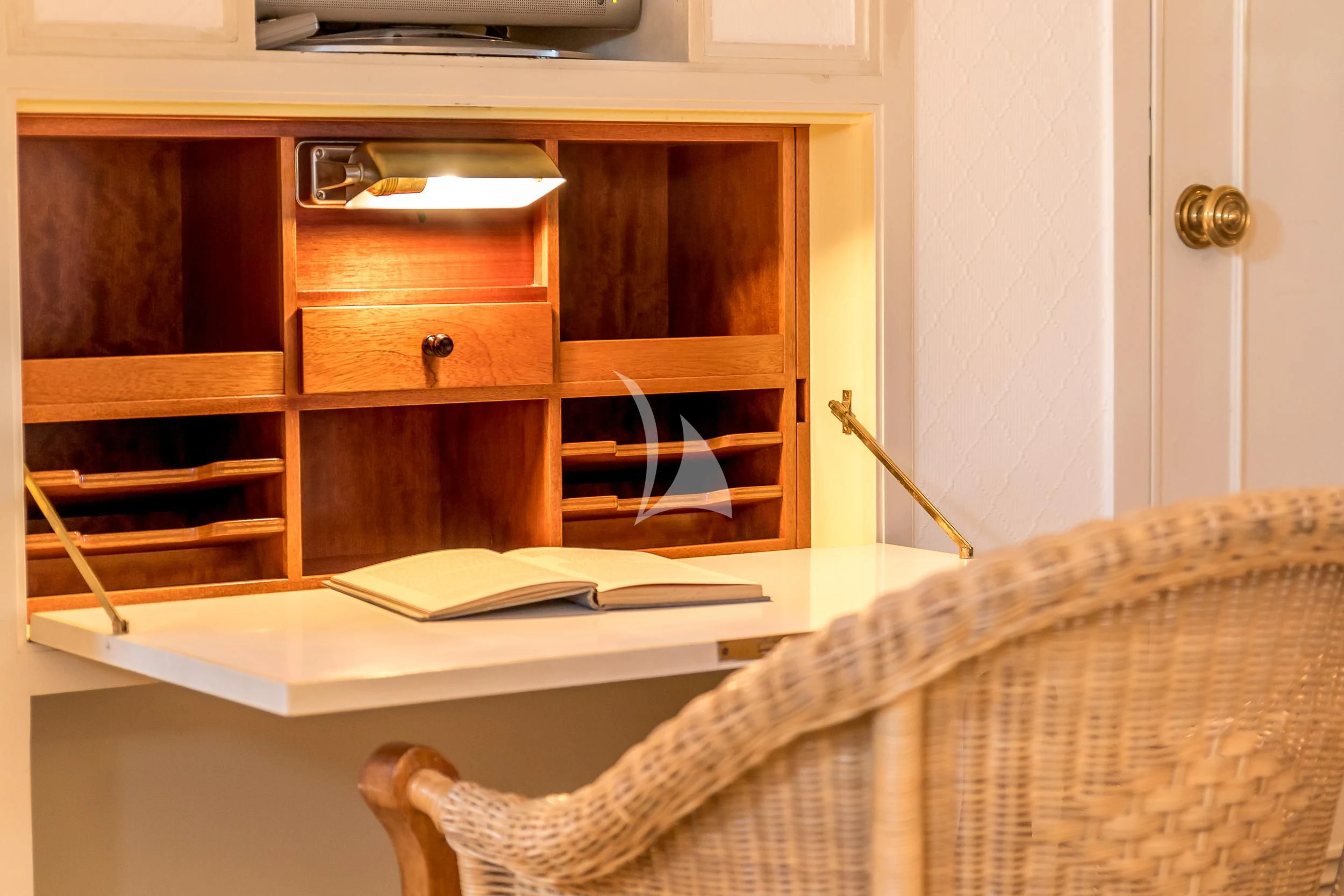 a bed with a white sheet and a wooden headboard aboard SECRET LIFE Yacht for Sale