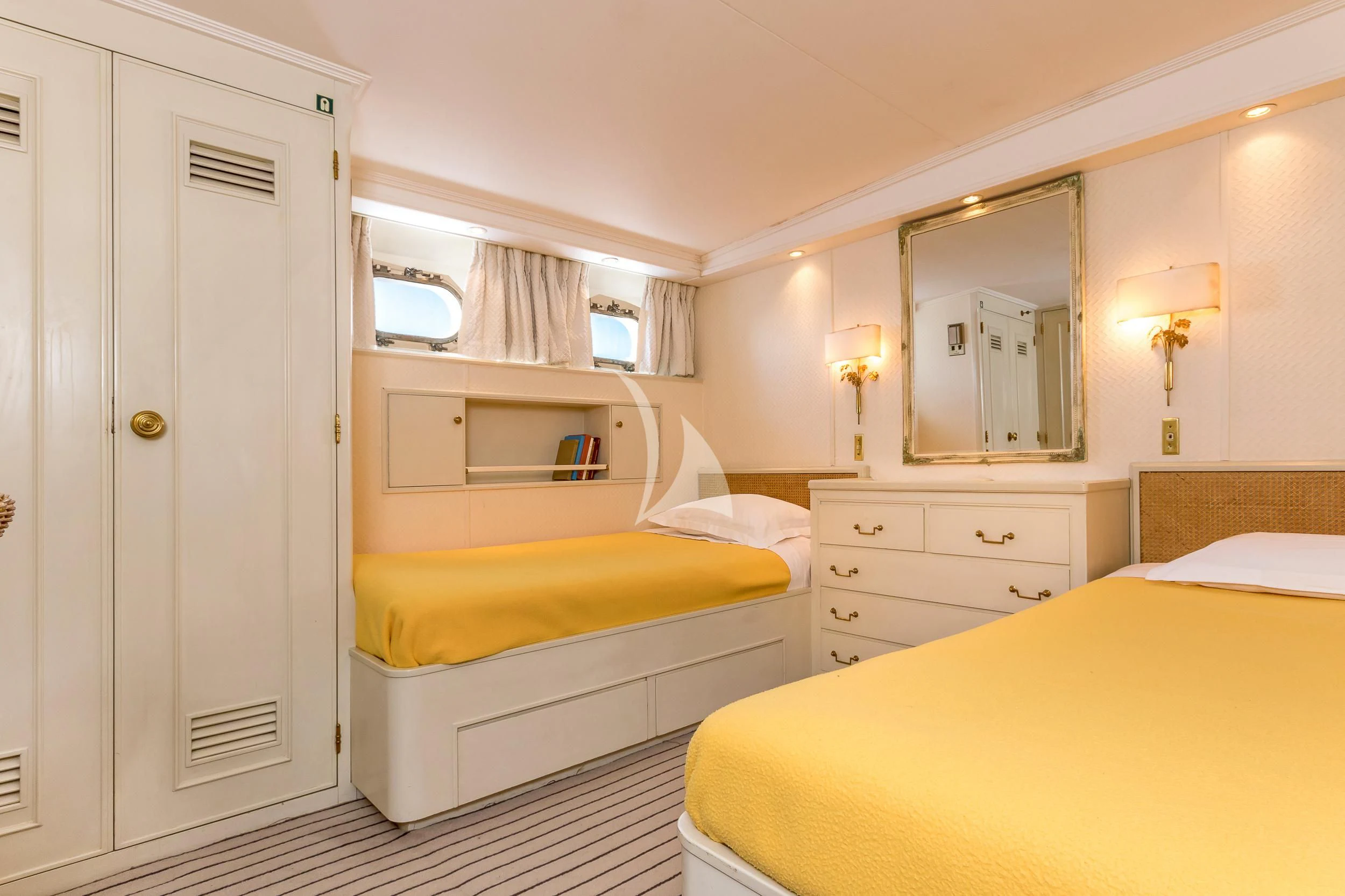 a room with a bed and a mirror aboard SECRET LIFE Yacht for Sale