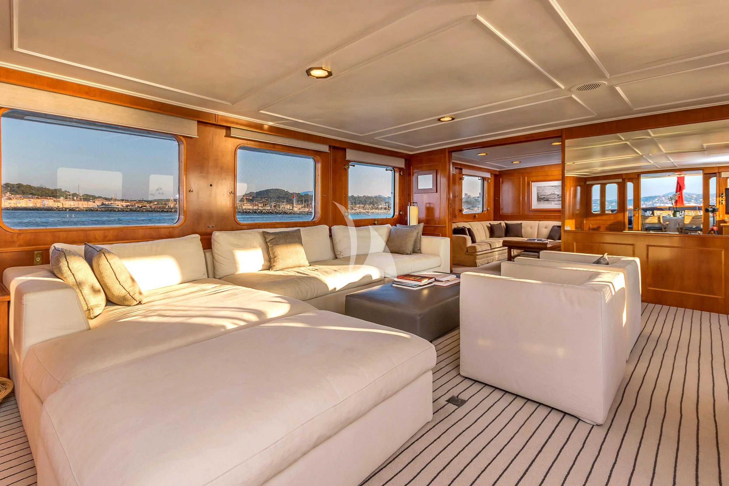 a large room with a bed and a couch aboard SECRET LIFE Yacht for Sale
