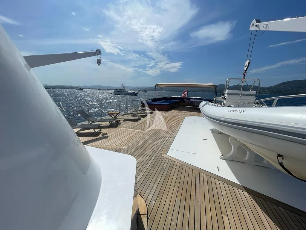 a deck with a deck and boats on it aboard SECRET LIFE Yacht for Sale