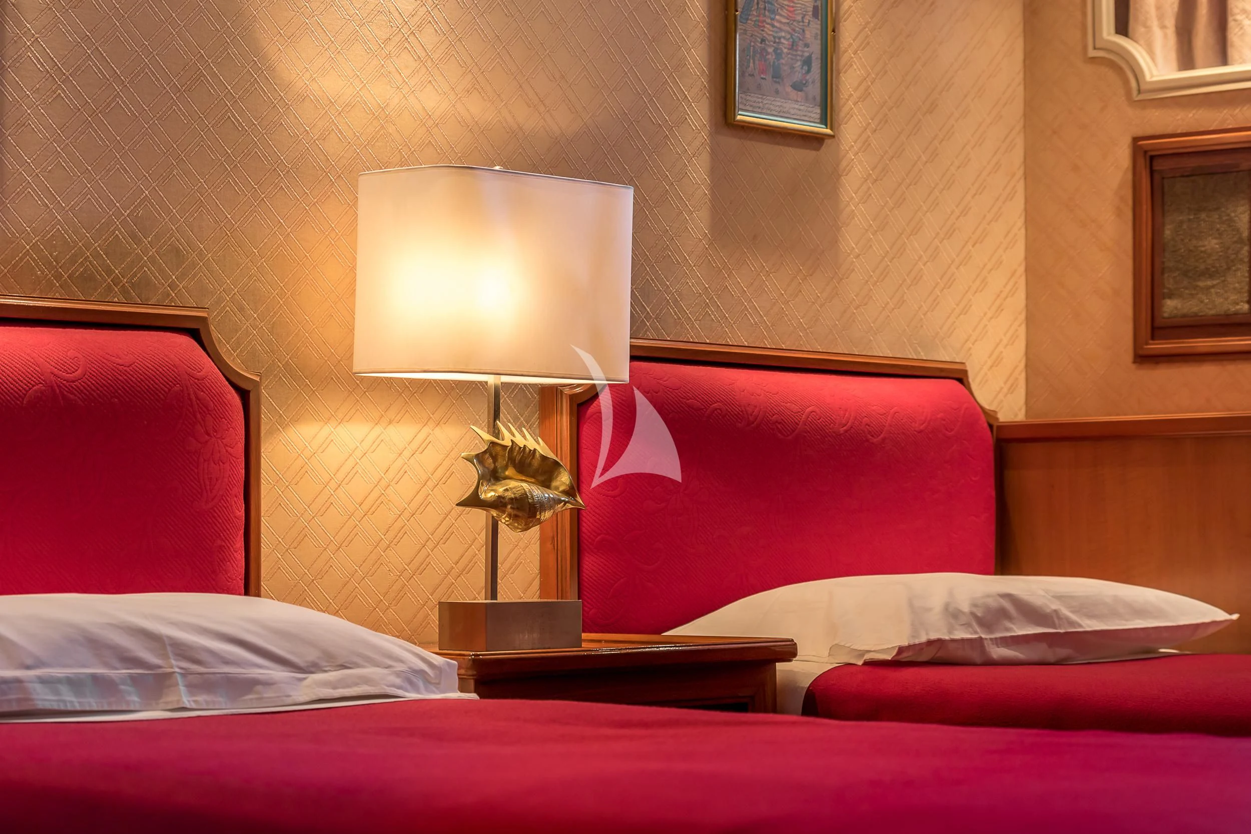 a lamp on a bed aboard SECRET LIFE Yacht for Sale