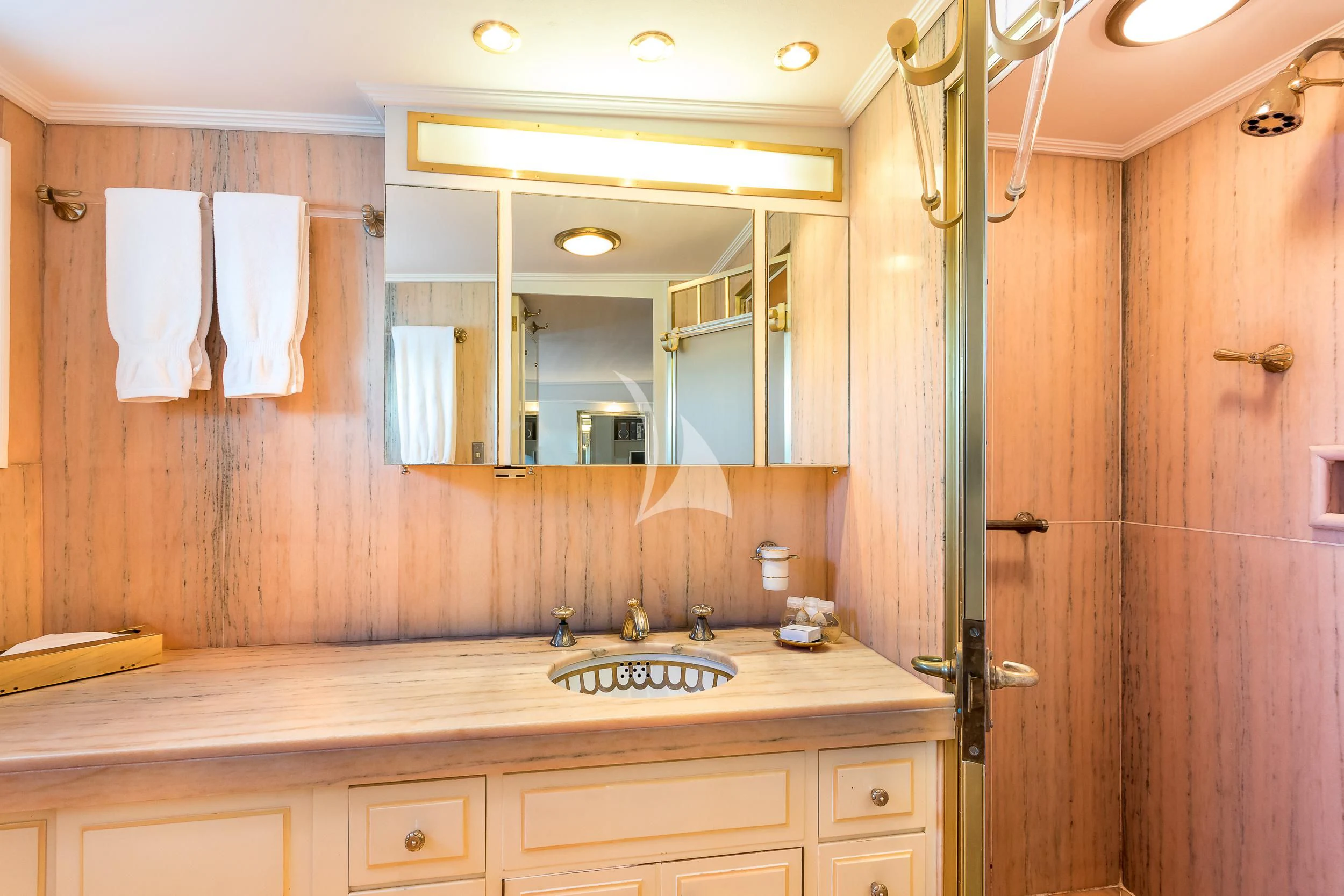 a bathroom with a sink and a mirror aboard SECRET LIFE Yacht for Sale