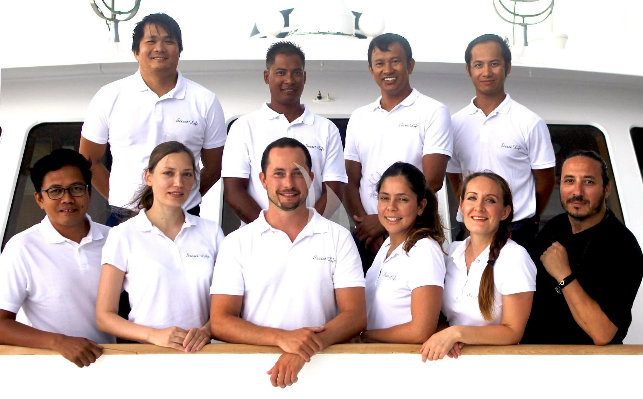 a group of people posing for a photo aboard SECRET LIFE Yacht for Sale