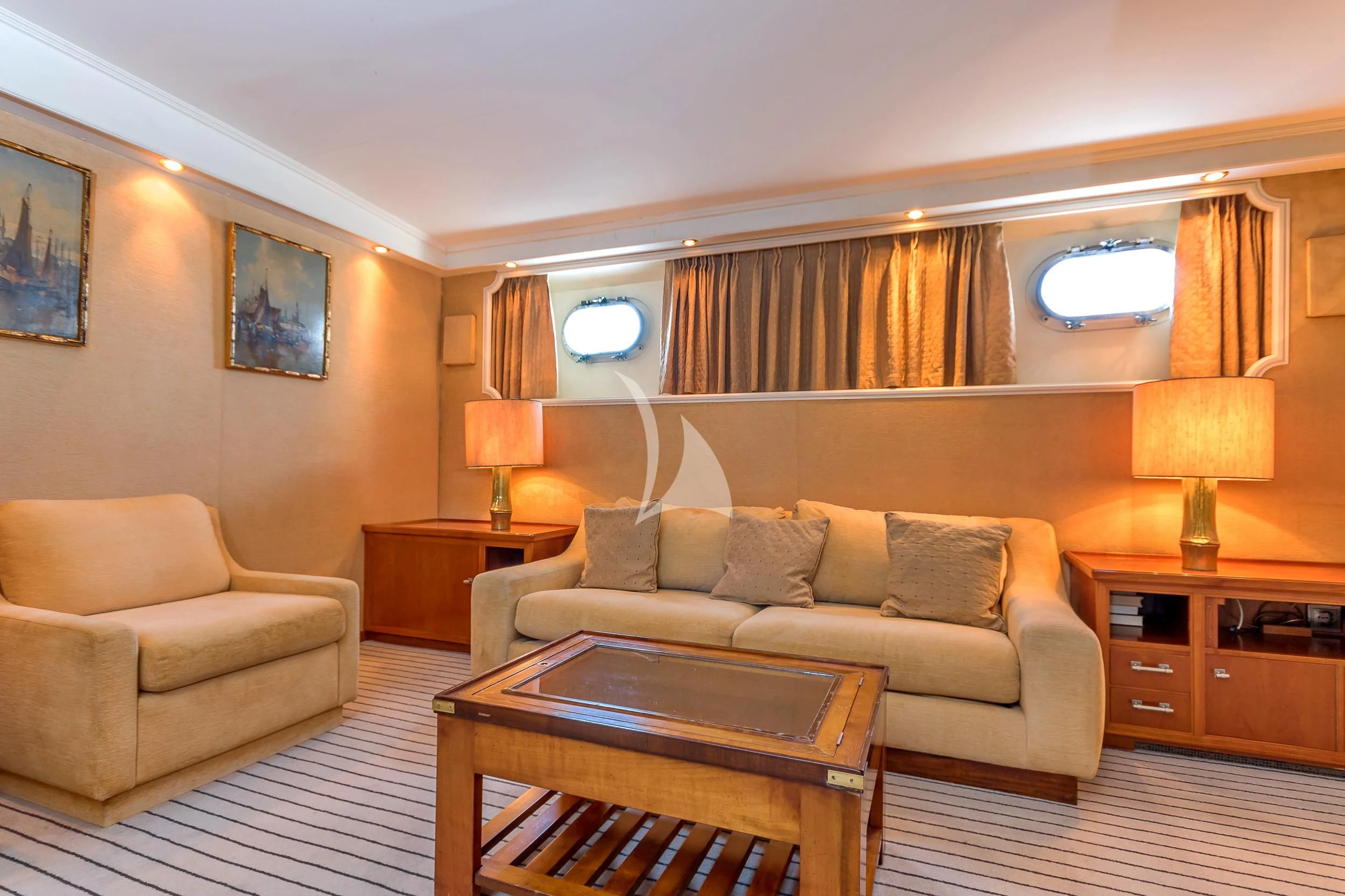 a living room with a couch and a coffee table aboard SECRET LIFE Yacht for Sale