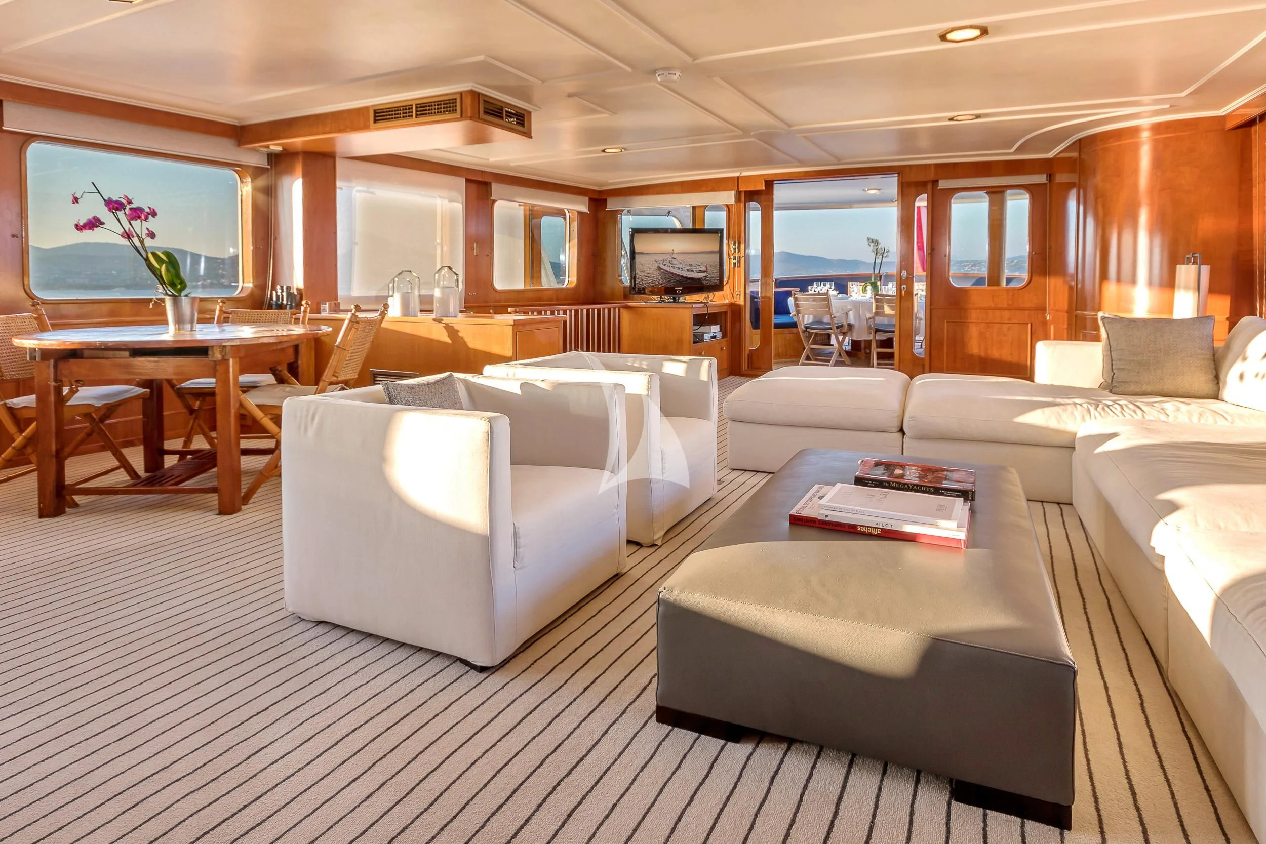 a room with a couch and a table aboard SECRET LIFE Yacht for Sale