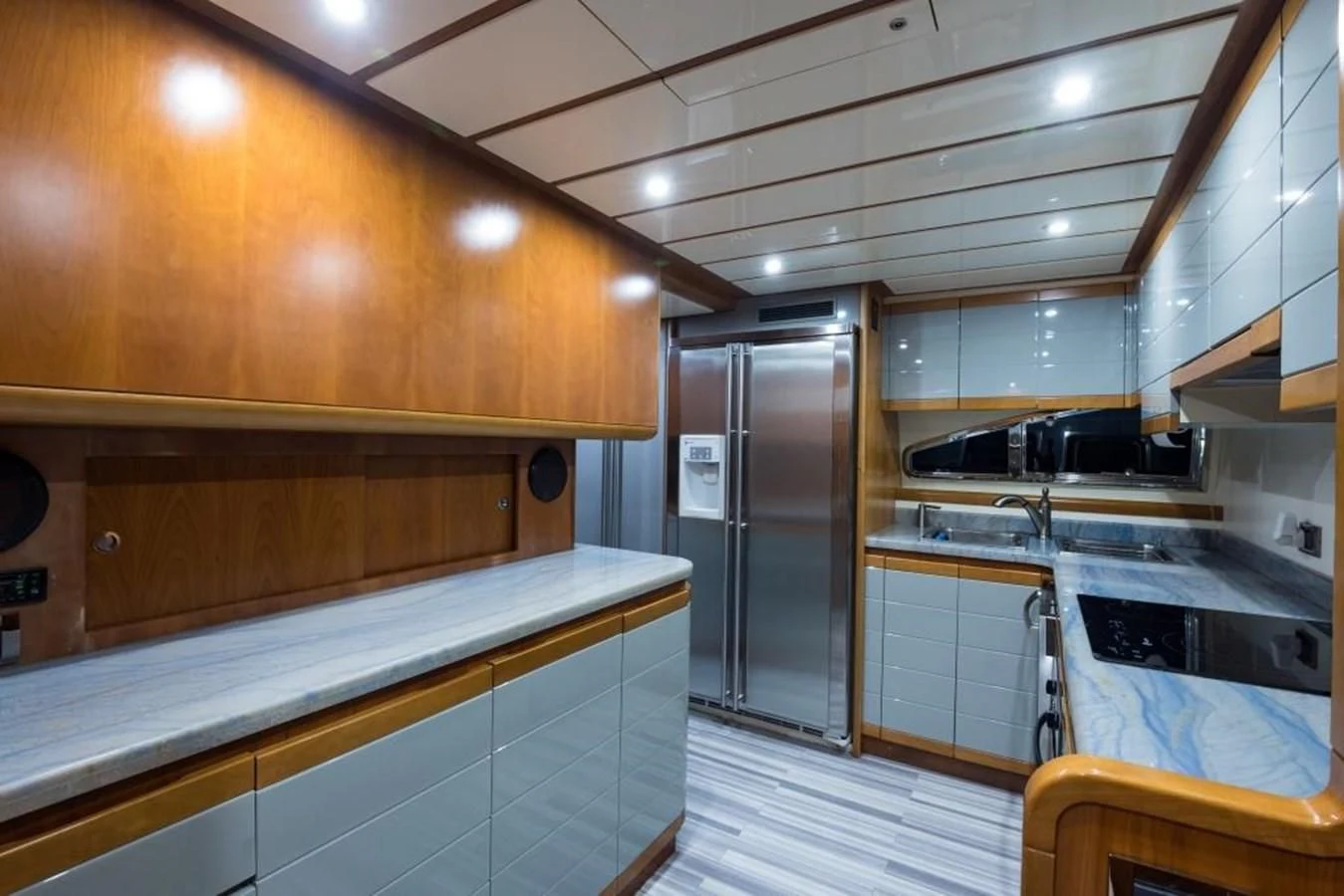 a kitchen with a large island aboard TOMORROW WE RIDE Yacht for Sale