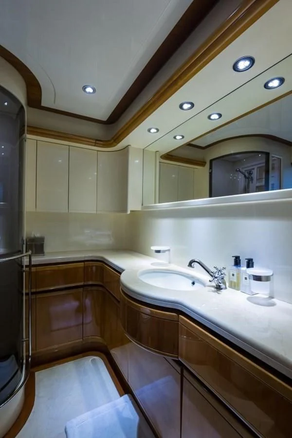 a bathroom with a sink and a mirror aboard TOMORROW WE RIDE Yacht for Sale