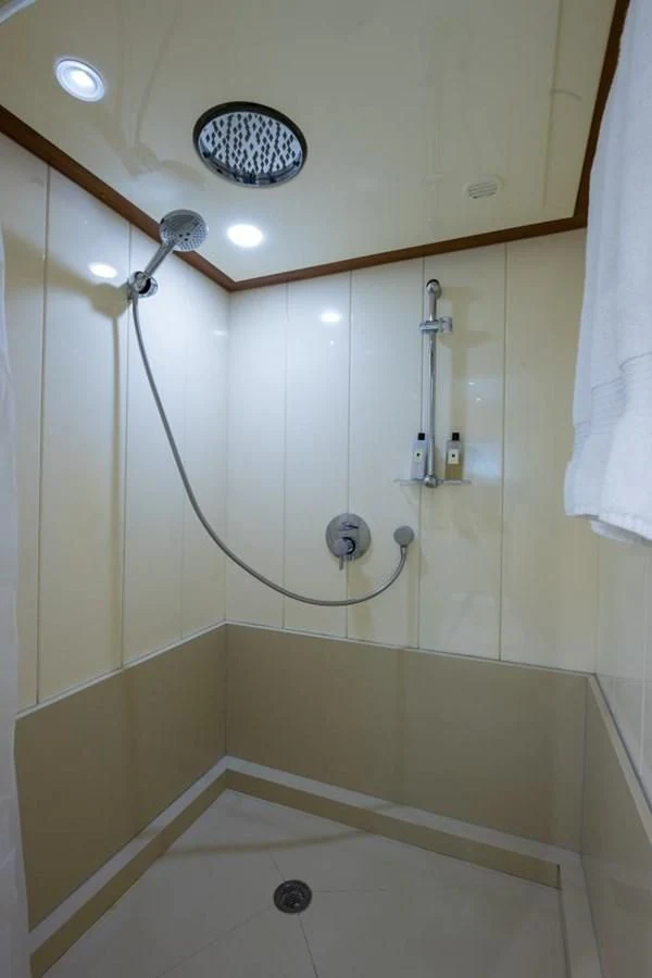 a shower with a round mirror aboard TOMORROW WE RIDE Yacht for Sale