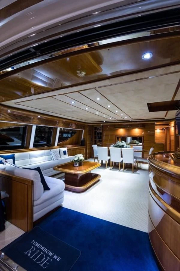 a room with a couch and a table and chairs aboard TOMORROW WE RIDE Yacht for Sale