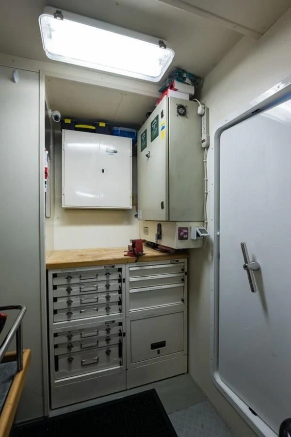 a kitchen with white cabinets aboard TOMORROW WE RIDE Yacht for Sale