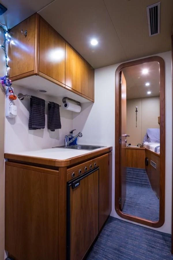 a bathroom with a sink and cabinets aboard TOMORROW WE RIDE Yacht for Sale