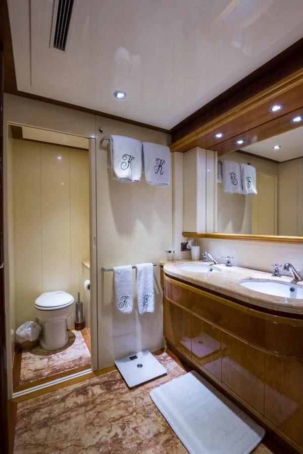a bathroom with a toilet and sink aboard TOMORROW WE RIDE Yacht for Sale