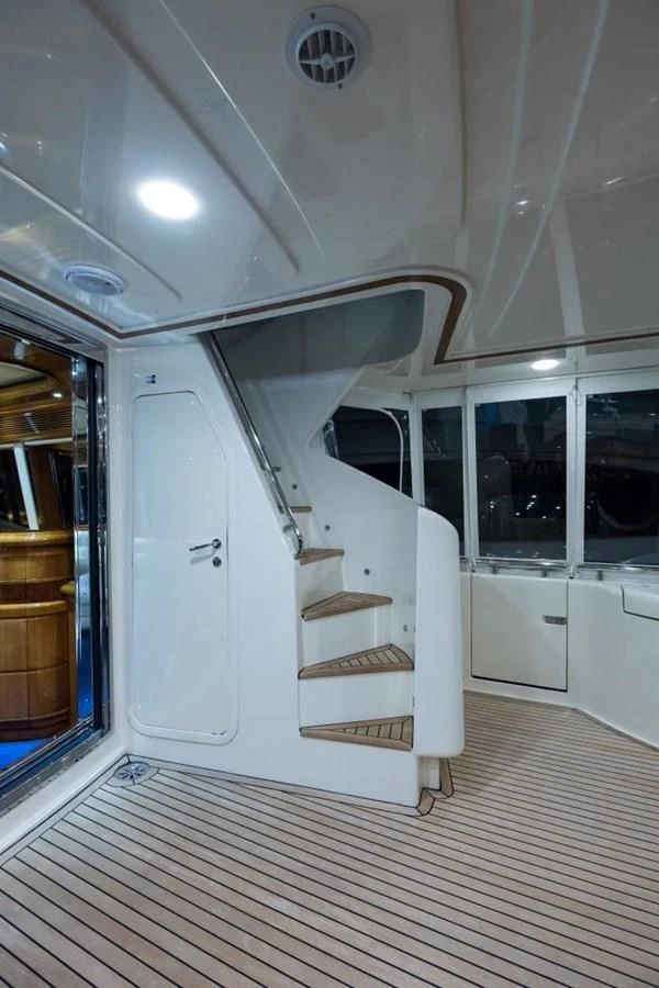 a white room with a wood floor aboard TOMORROW WE RIDE Yacht for Sale