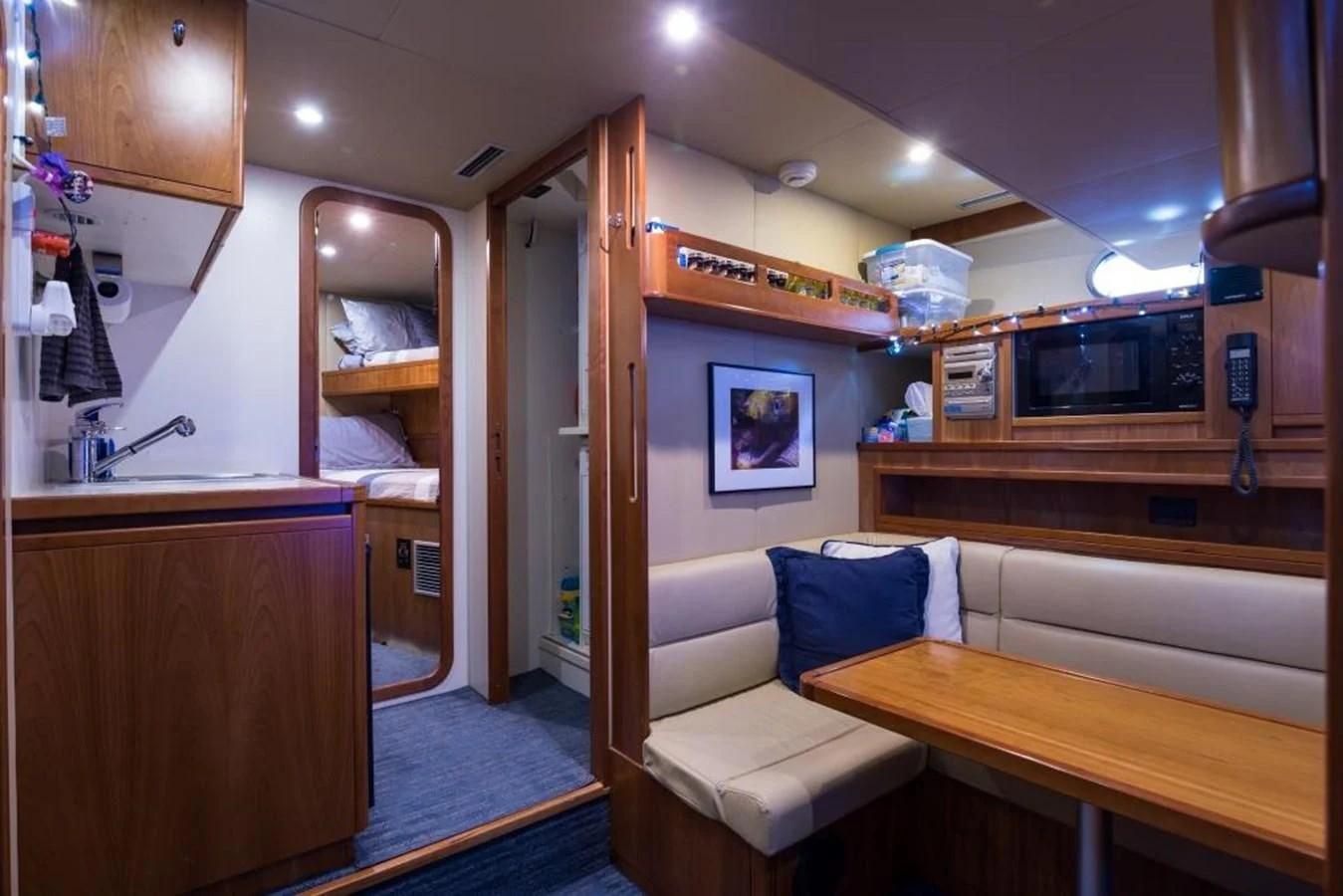 a room with a bed and a television aboard TOMORROW WE RIDE Yacht for Sale