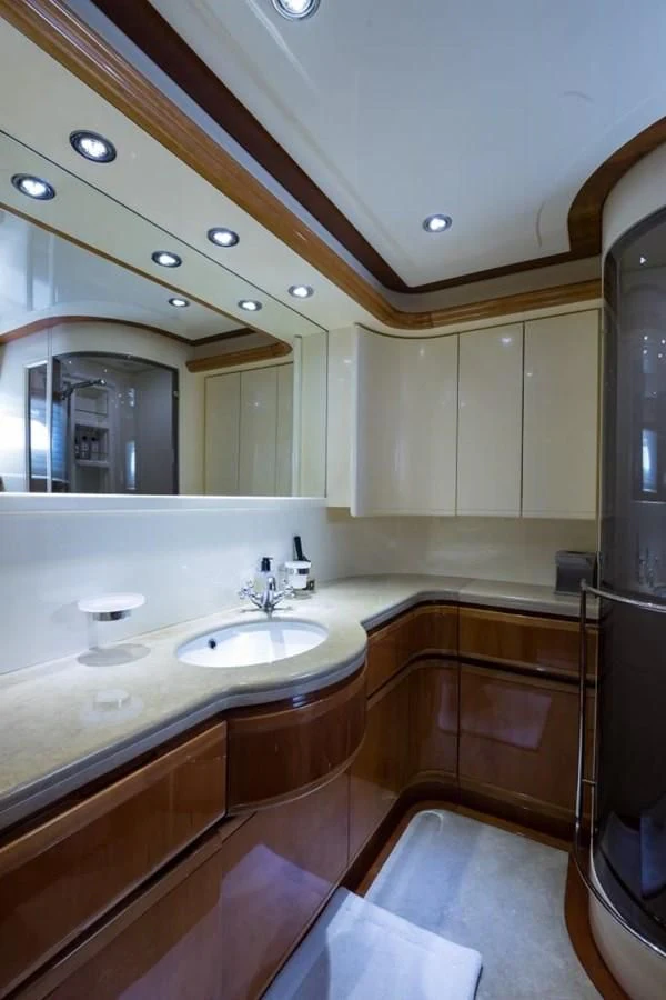 a bathroom with a large mirror aboard TOMORROW WE RIDE Yacht for Sale