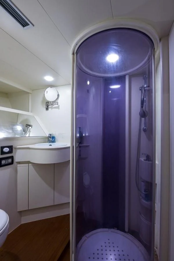 a shower with a sink and a mirror aboard TOMORROW WE RIDE Yacht for Sale