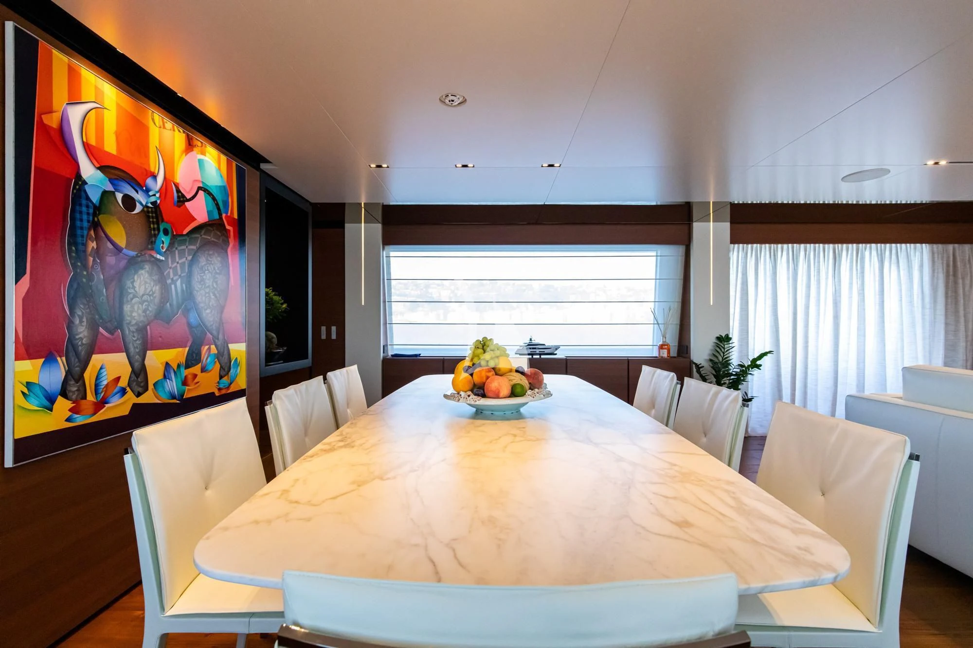 a table with a bowl of fruit on it aboard SOUTH Yacht for Sale