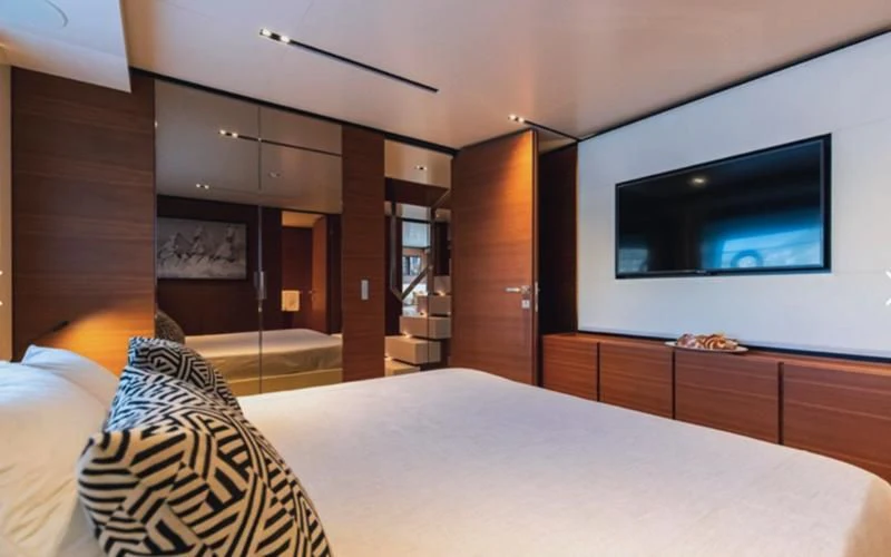a bedroom with a large tv aboard SOUTH Yacht for Sale